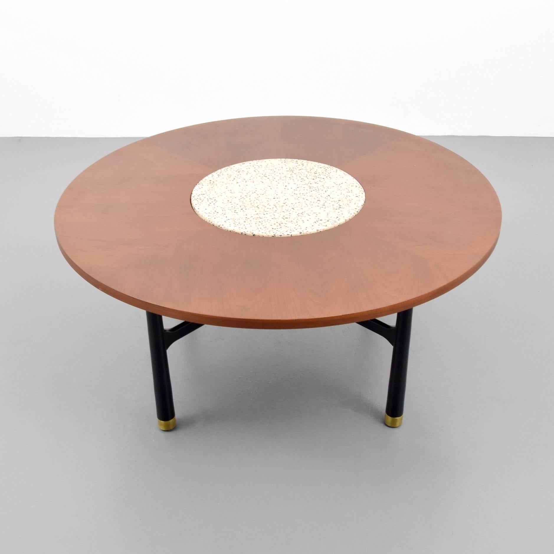 Coffee table with terrazzo insert and brass sabots by Harvey Probber.

Harvey Probber preferred simple lines in his designs. He would often use hardware and color in upholstery or wood to add contrast and emphasize the details.  He was known for his