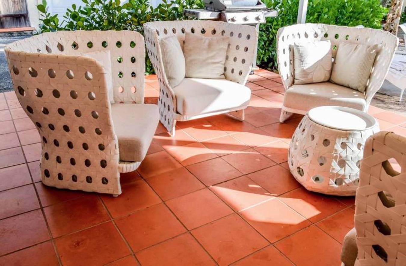 Three lounge chairs, sofa and table designed by Patricia Urquiola for B&B Italia outdoor. Suite is from the CANASTA line.

Materials: fabric, polyethylene

Dimensions: 
Chairs 34.75" H, 38.5" W, 25" D
Side table 18" H,