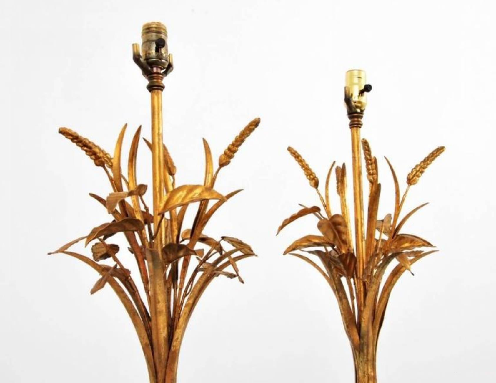Fine pair of blown glass lamps with gold aventurine throughout and decorative metal elements attributed to Barovier & Toso, Murano, Italy.