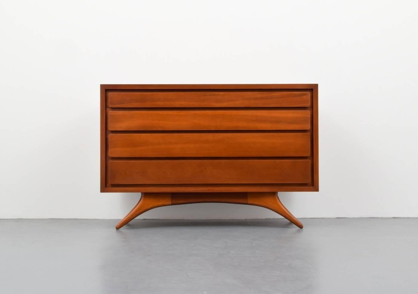 Rare and early cabinet/dresser with four floating drawers on sculpted legs by Vladimir Kagan. Chest is similar to smaller models of #3401 and #3501. Cabinet is from a single-owner collection of early Vladimir Kagan furniture (please see the other
