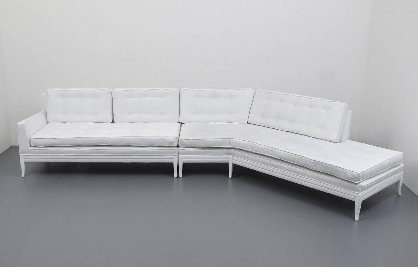 Large two-piece sectional sofa by Tommi Parzinger for Parzinger Originals. The sofa has been refinished and reupholstered.  Provenance:  Rago Arts, Lot 718, 9.23.2017.

Tommi Parzinger's meticulous detail in his early work as a silversmith was
