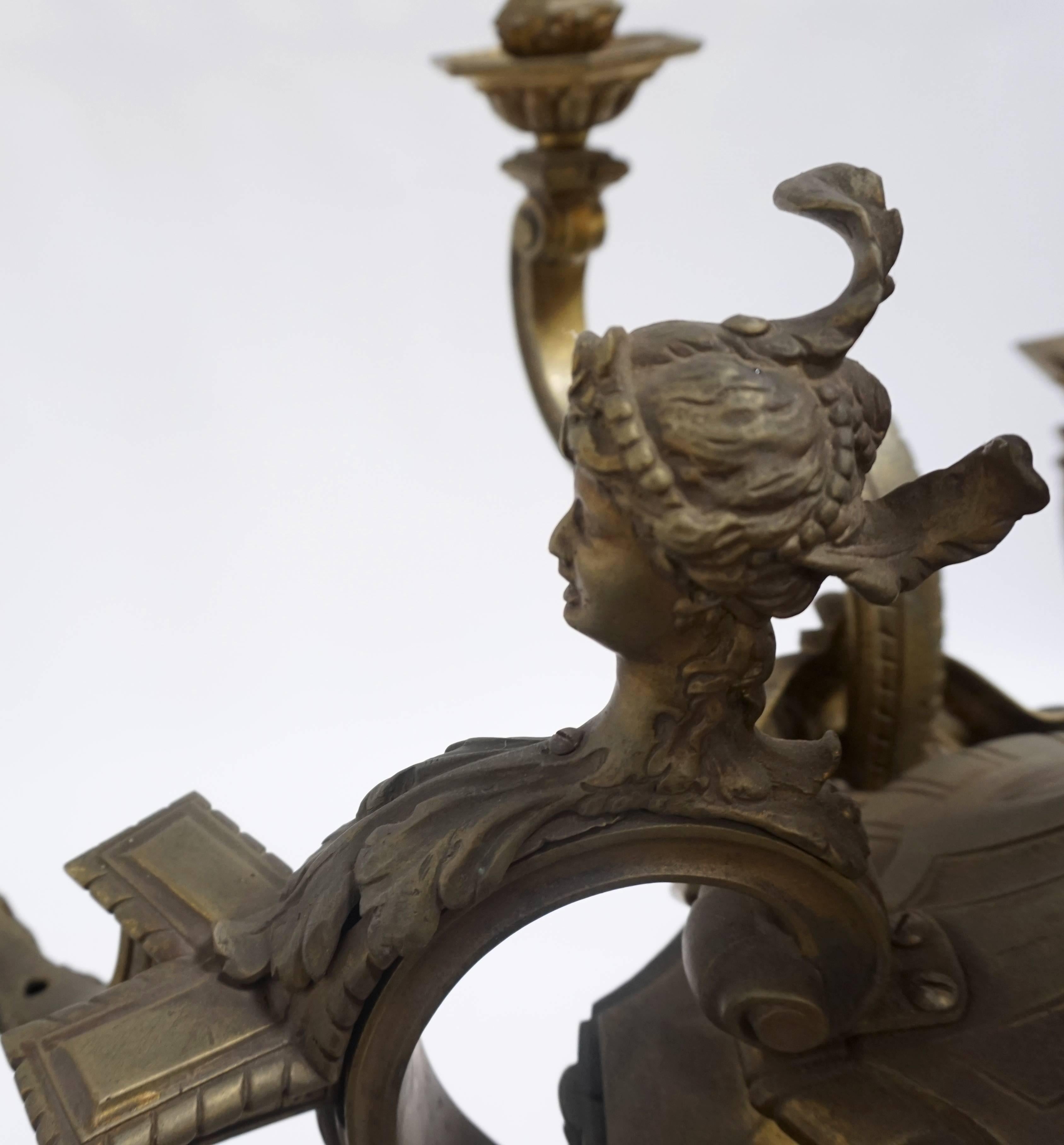 Striking, ornate, second Empire bronze chandelier. Amazing castings of acanthus leaves, other flora, bearded gods, heraldic ladies, and shells. Nine lights, newly wired, UL listing available for an additional fee, Paris, circa 1870.

We offer UL
