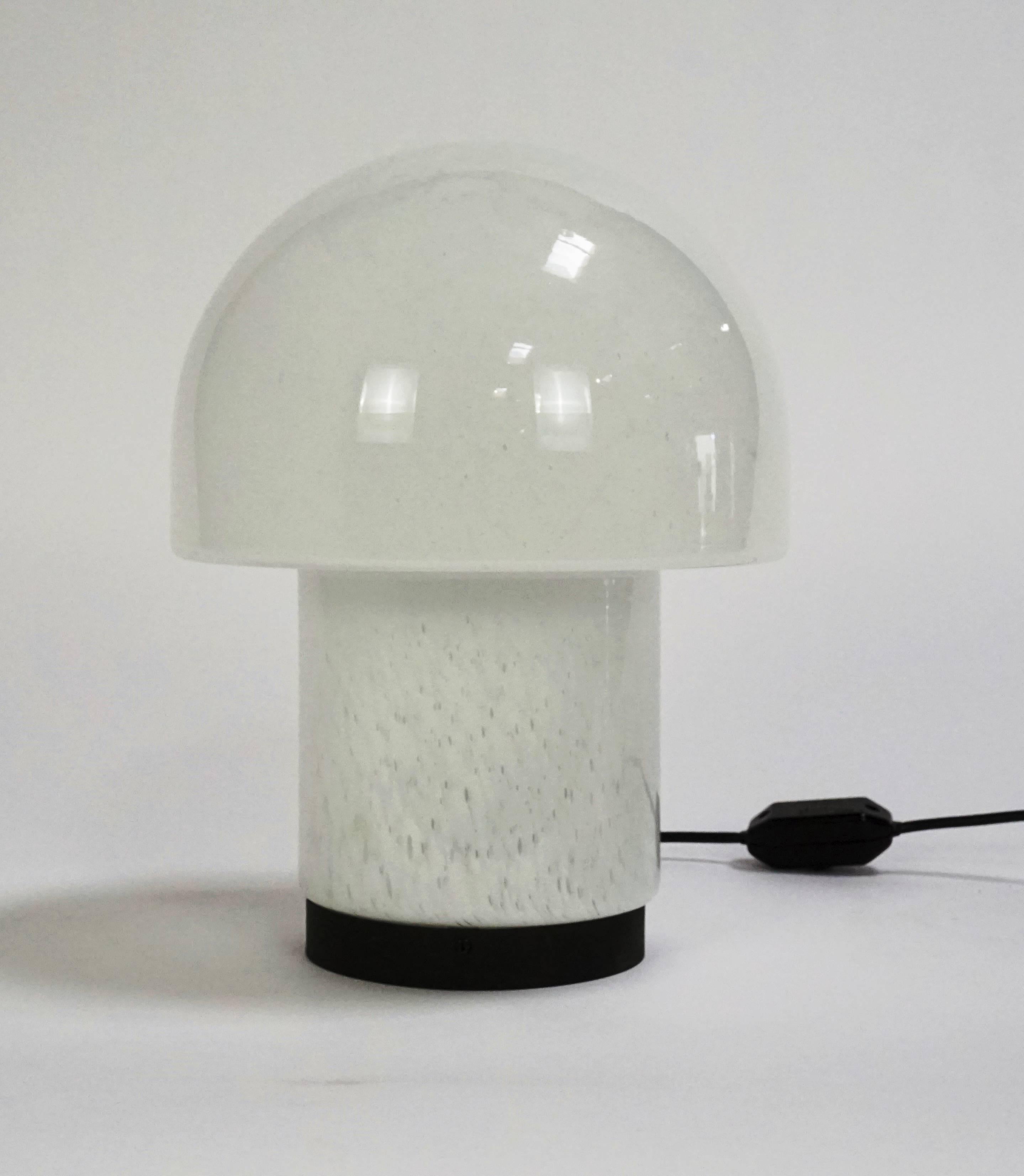 Mid-Century mushroom shaped art glass table lamp by Glashutte Limberg. Veriegated white glass with black base. Newly wired.