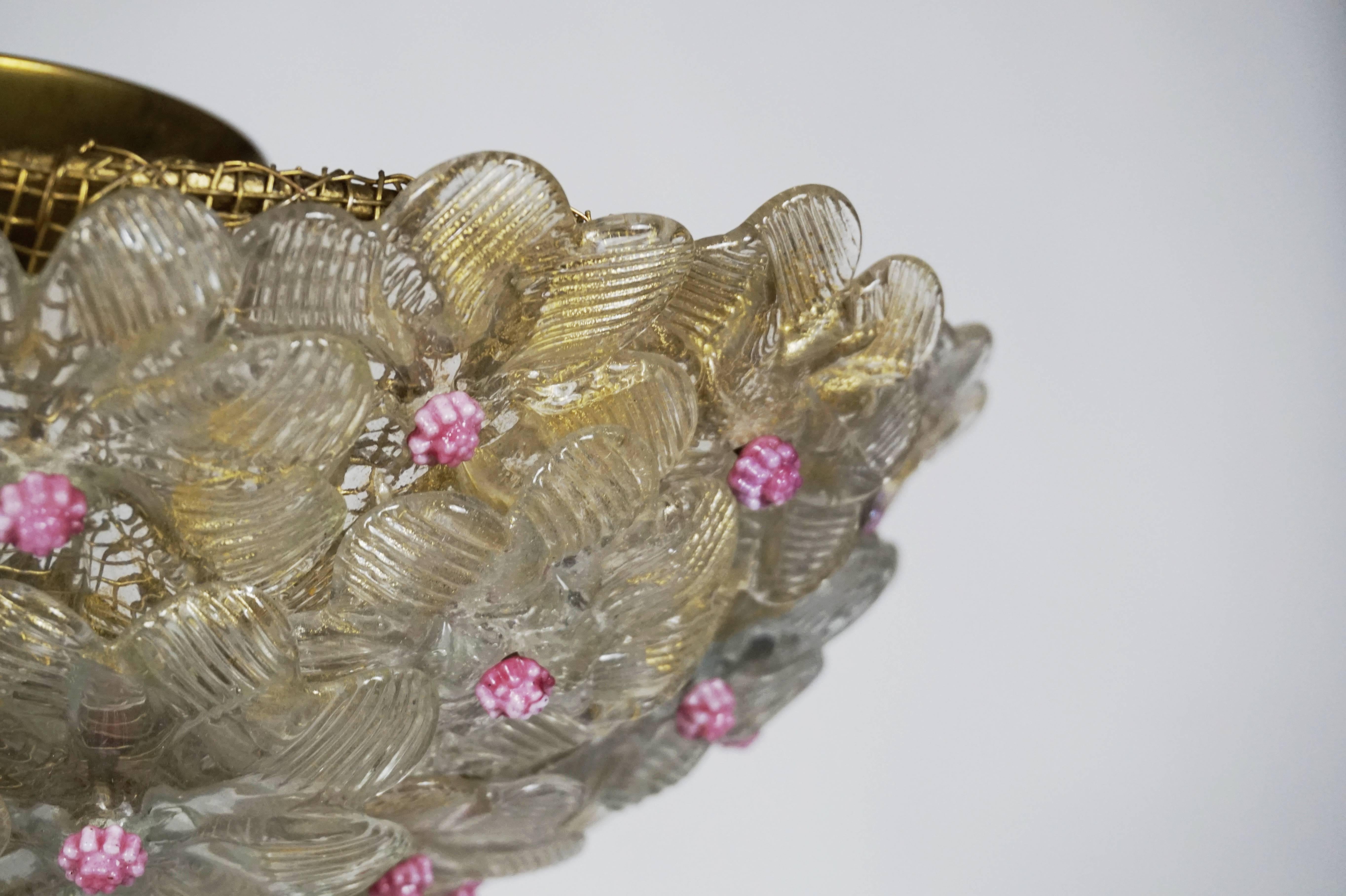 Clear and pink floral accent ceiling fixture made up of hundreds of small glass flowers. Brass hardware. Recently rewired with four porcelain Edison based sockets. UL listing available for an additional fee.