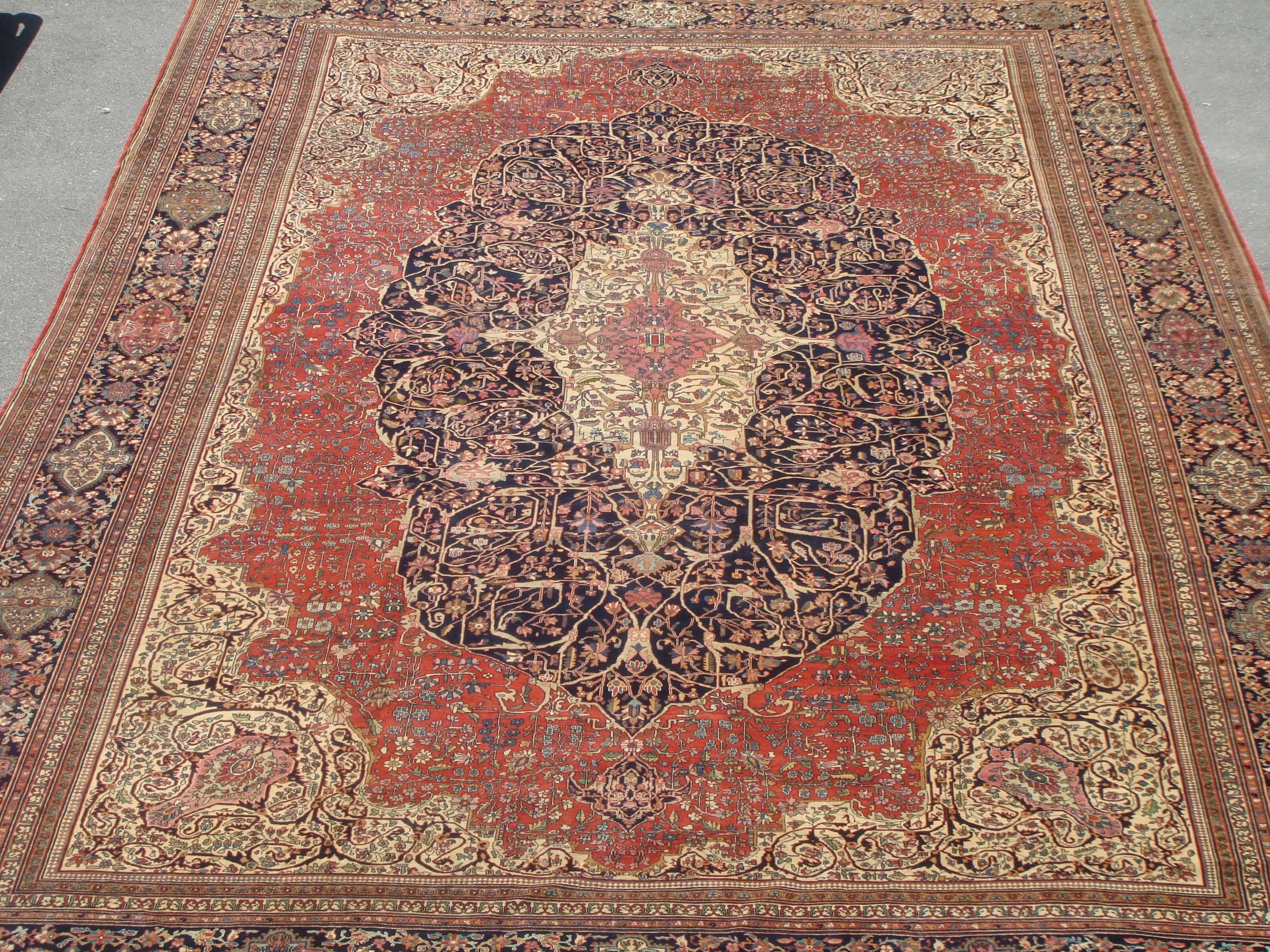 This is a beautiful palace style antique Farahan rug, circa 1880s. This is a beautiful example of a Classic Farahan rug with beautifully stylized center medallion in burned orange rust with smaller medallion in navy blue and an ivory medallion. The