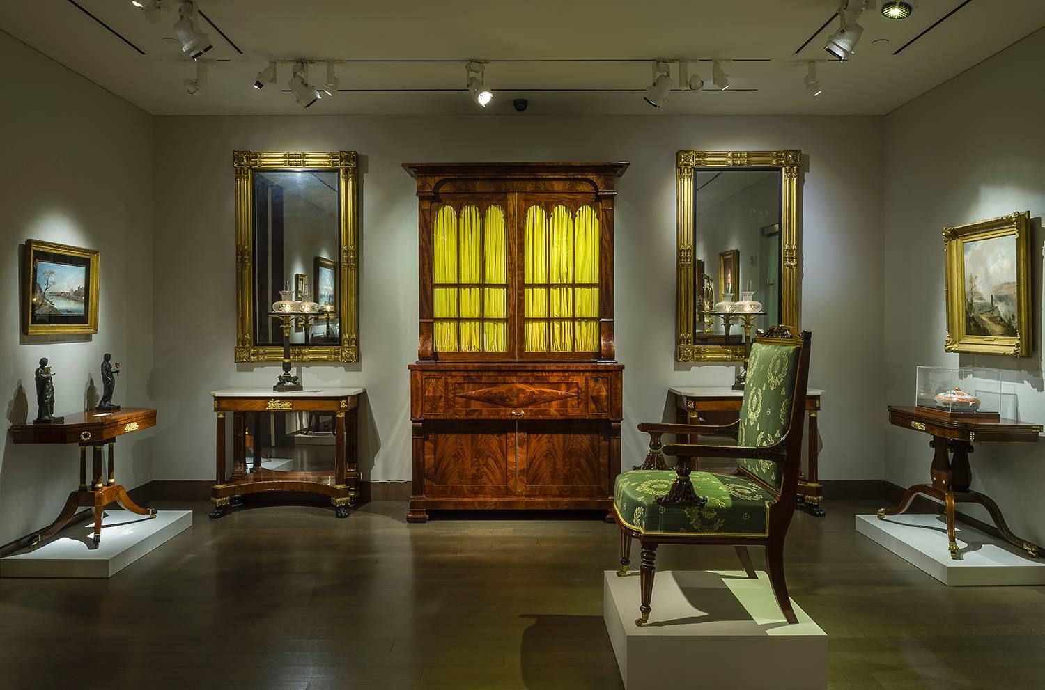 Boston, Massachusetts, about 1820
Eastern white pine, gessoed and gilded, with ebonized liners and mirror
Each, 65 1/8 in. high; 37 1/2 in. wide
Inscribed (on back of frame and backboard of each): Top

This pair of mirrors is identical to a