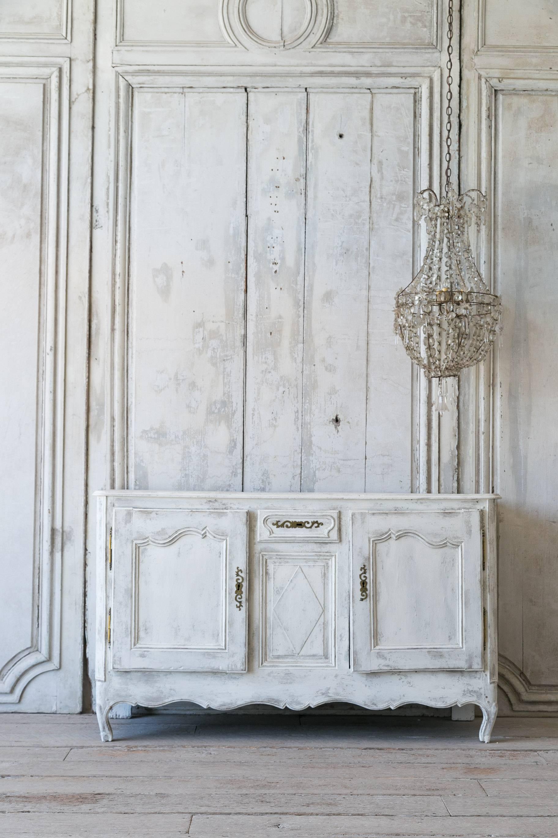 Lovely Antique Louis XV Style Sideboard in a light grey white wash finish. Two doors on either side with one drawer add functionality to this classic piece. Includes a set of functional keys.