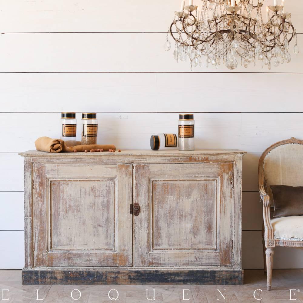This antique French cabinet from Le Moulin a Vent in Provence boasts a natural wood finish with Cafe au Lait wash and distressed black base. The two cupboards open to a single but generous interior shelf and original hardware adds a historical touch.
