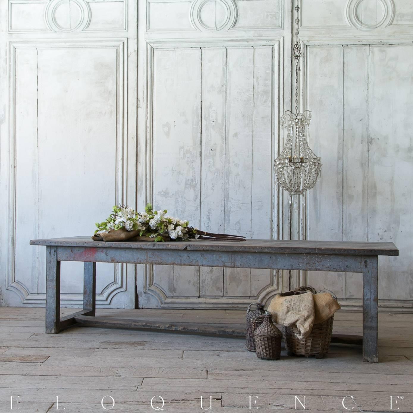 Rustic antique oak farm table from Provence in stormy blue grey distressed finish. The juxtaposing stroke of bright crimson red on one edge and stretcher underneath add to the charm of this unique piece.