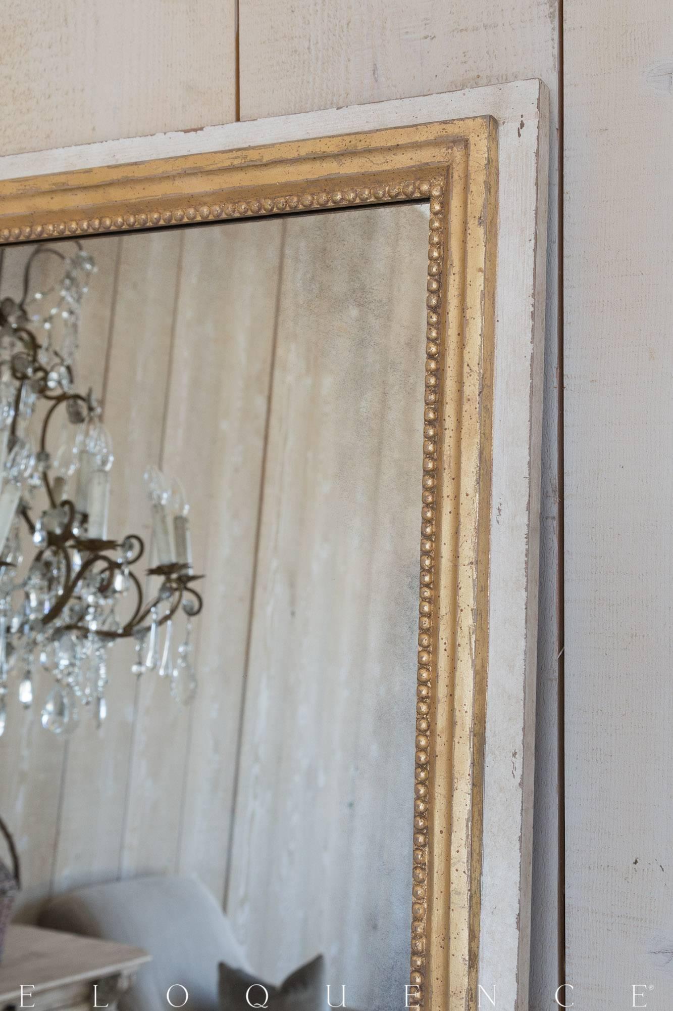 Eloquence® Grande Eugenie Panel Mirror in Toasted Almond. This gorgeous Grande mirror will fill your space with luxury and light. The hand aged glass and hand finished frame are classically designed, with lovely beading adorning the inner edges.