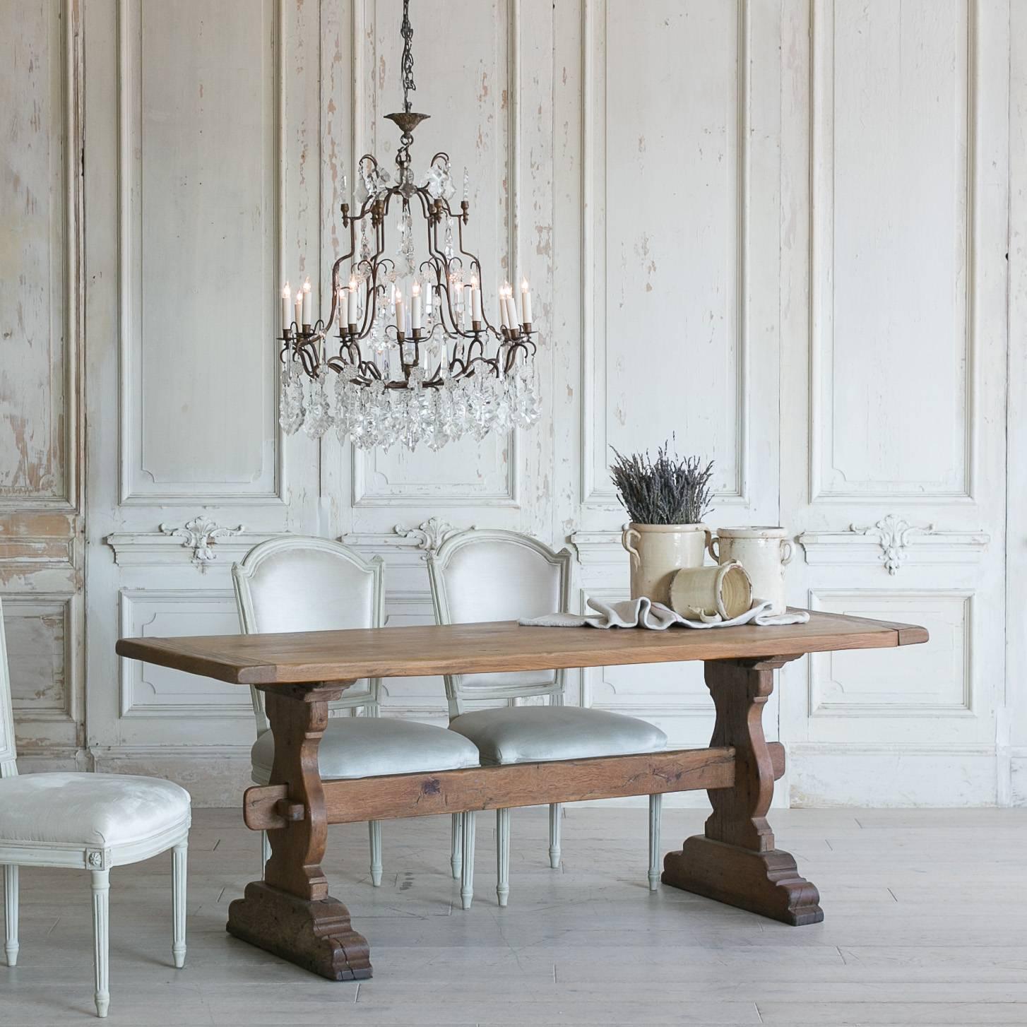 Sweet vintage oak dining table in a classic monastery style with all-wood joinery. Sturdy wood pegs hold the tabletop and legs together. A spectacular table in amazing condition with just a few cracks that subtly point to the age of the piece. The