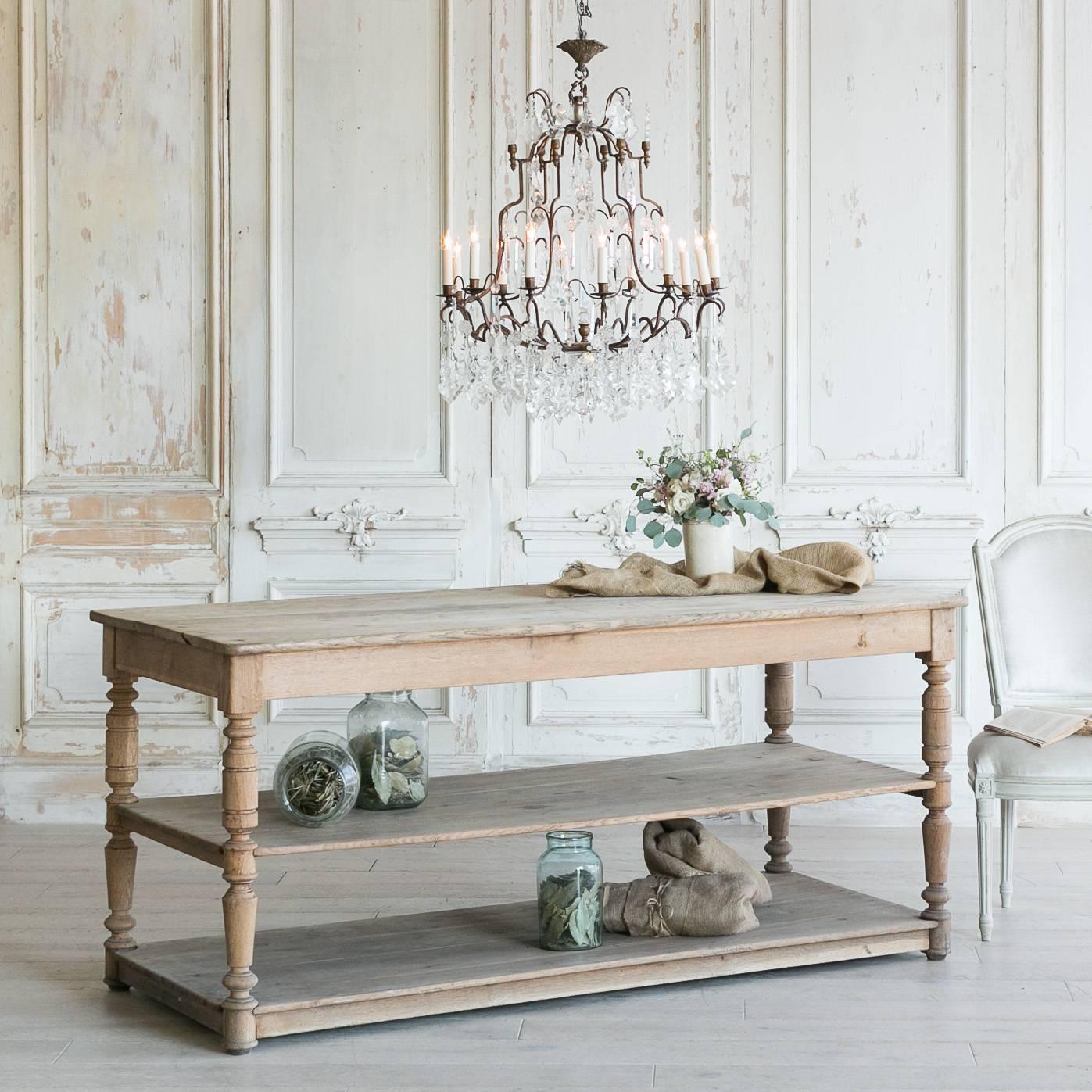 Gorgeous three-tiered antique oak drapery table featuring a second level for convenient storage or display. Large and broad, this piece boasts a spacious work space perfect for a large project or kitchen stash. Simple turned legs add stability and
