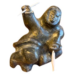 Early 20th Century Canadian Inuit Soapstone Figure with Bone Tusk and Fish