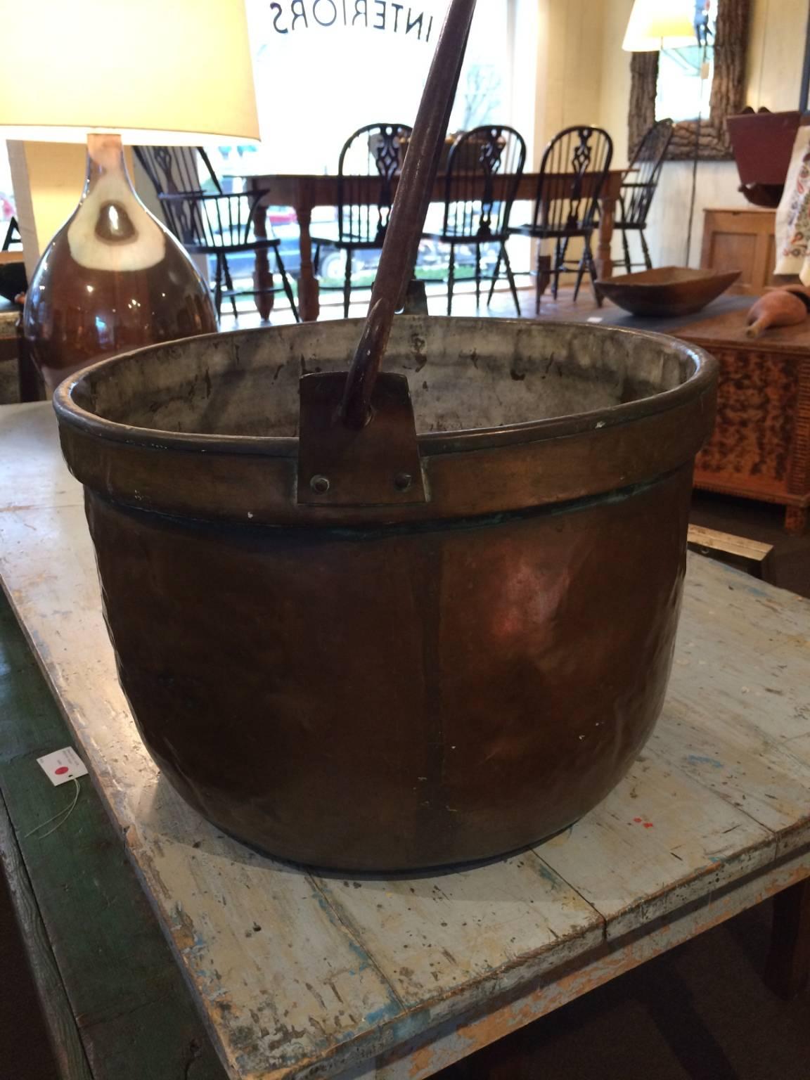 Large copper pot with evidence of use.