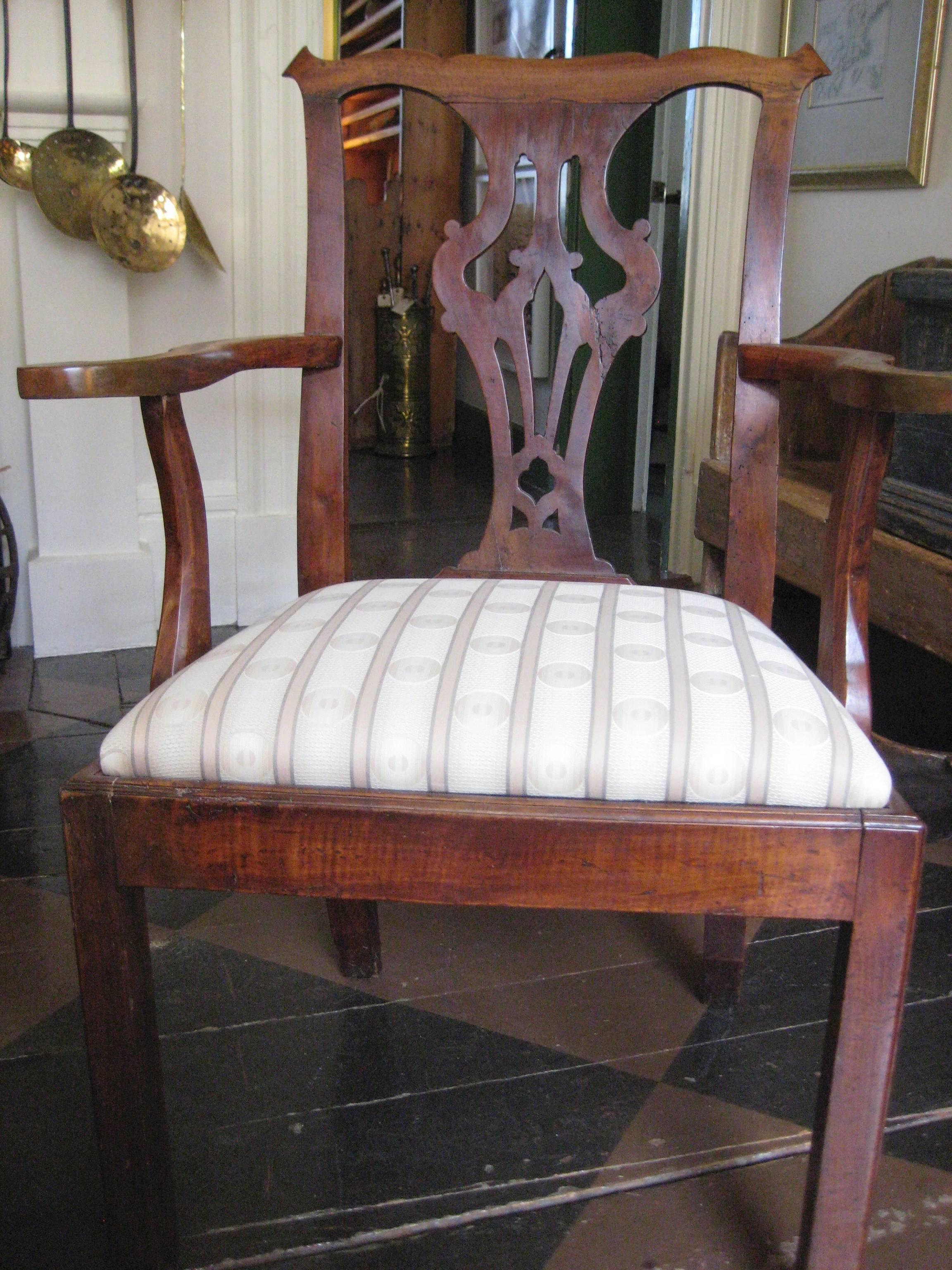 Antique Elm Chippendale Arm chair with upholstered seat.