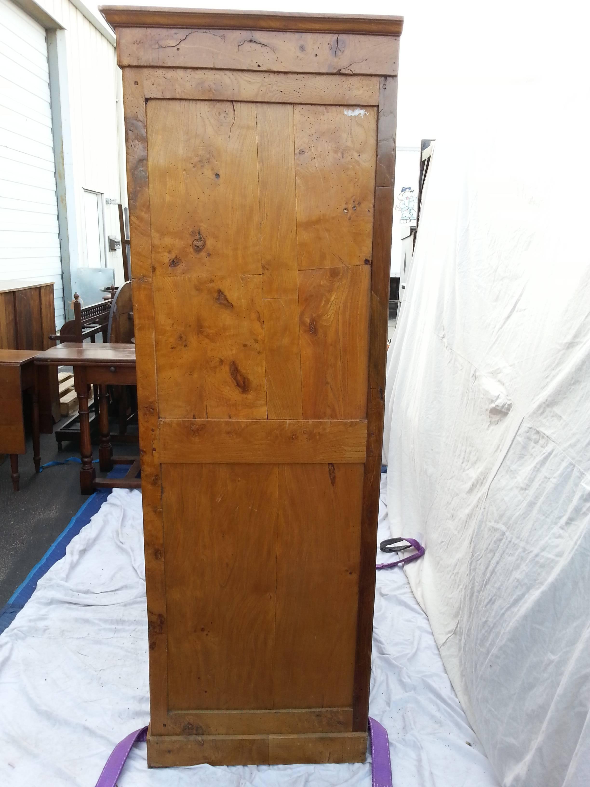 Large 19th century English Elm armoire.