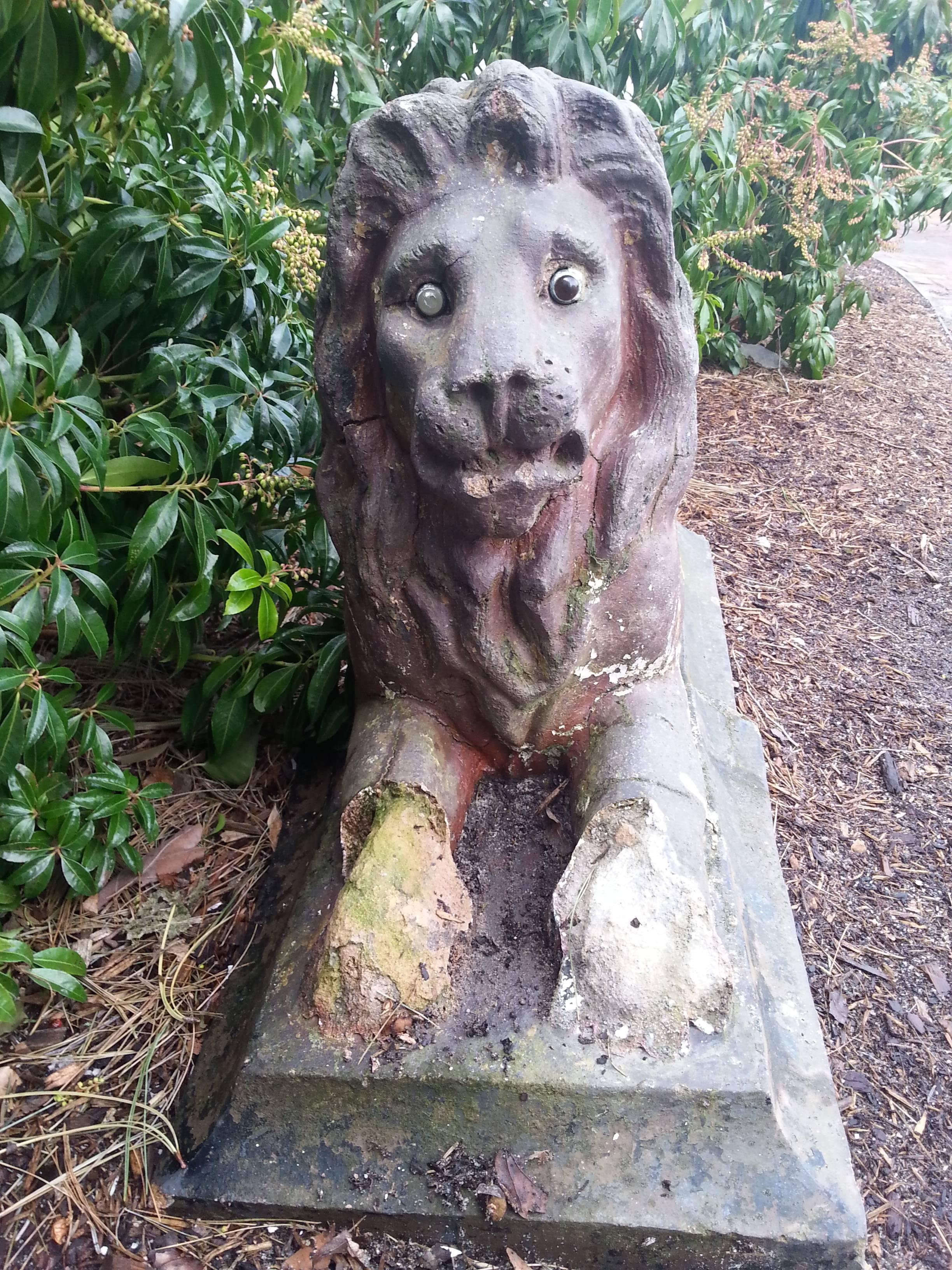 Iron Lion garden ornament. Exterior painting. Minor structural repairs due to age of this piece. 