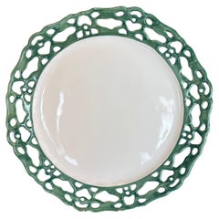 French Openwork Charger with Wide Lace Rim in Sage Green Over a Plain White Wall