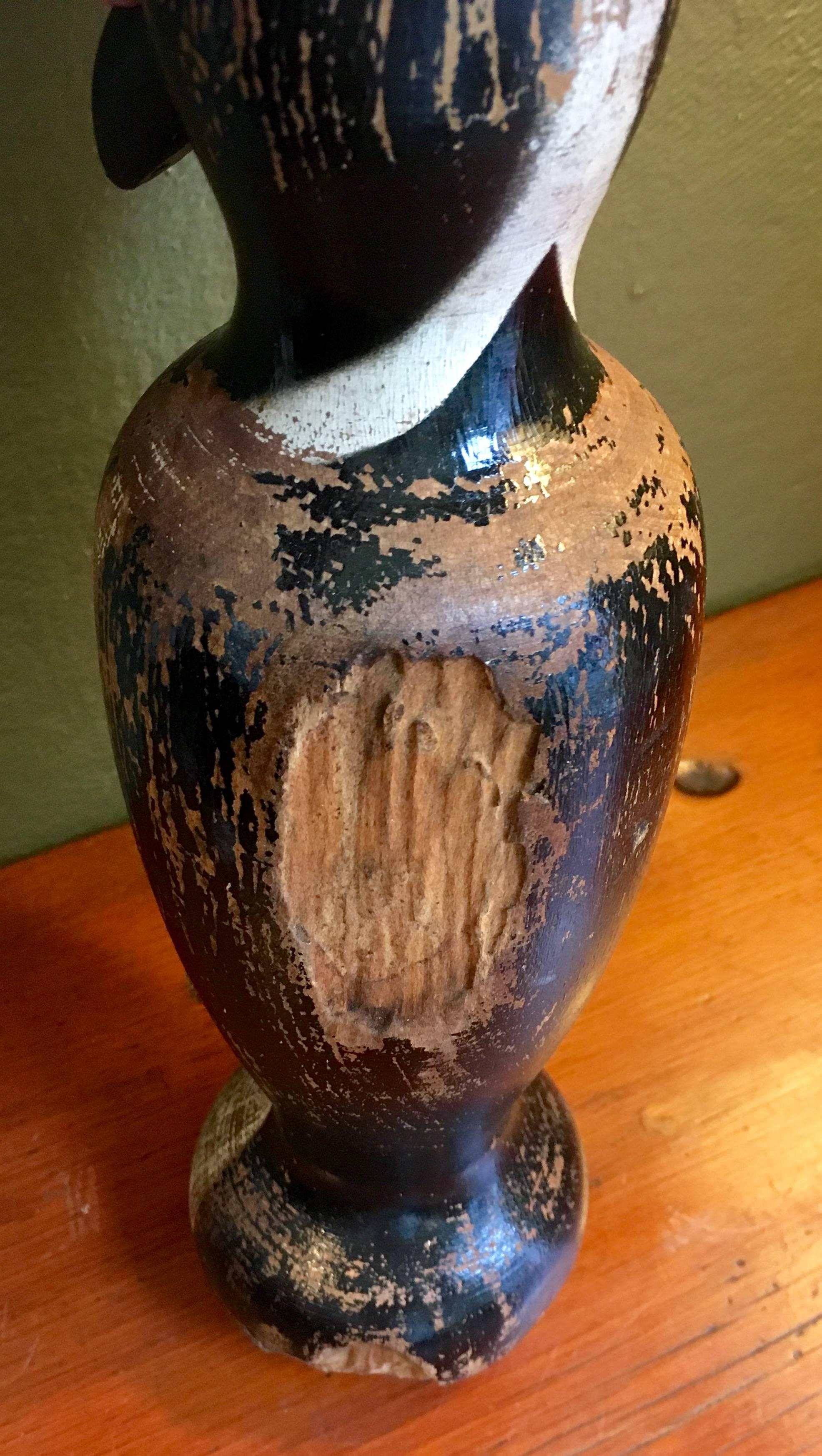 Folk Art carved and decorated whimsical penguin bowling pin, patented in 1922. Chipped areas and paint loss from use. Great folky look.
      