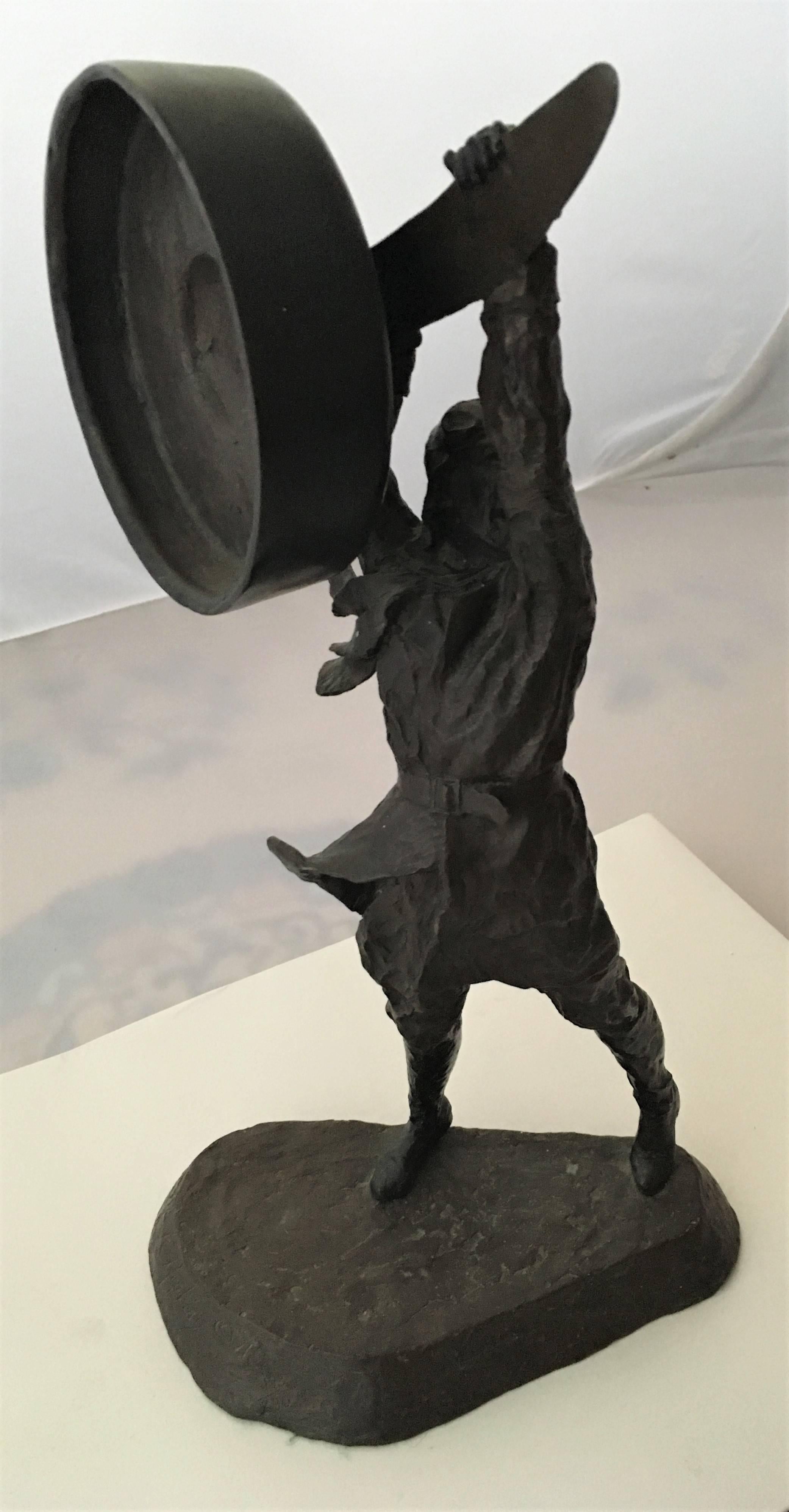 Cast bronze sculpture of an early aviator by Mark Hopkins, 1991, depicting a World War I era pilot in leather helmet and boots, poised to swing his propeller. Cast in a limited run, this one #193/750. Signed and numbered by artist on base.