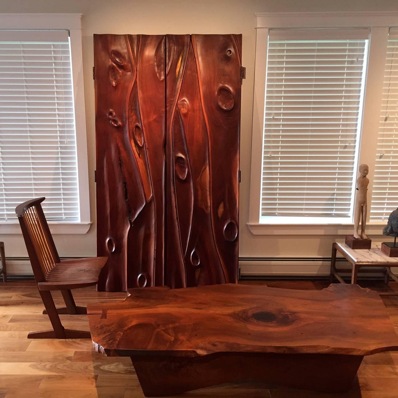 These two doors were commissioned directly from the artist and were made for a specific site . The front of the doors are wonderfully contoured and are highly sculptural. The design retains the original qualities of the wood including natural