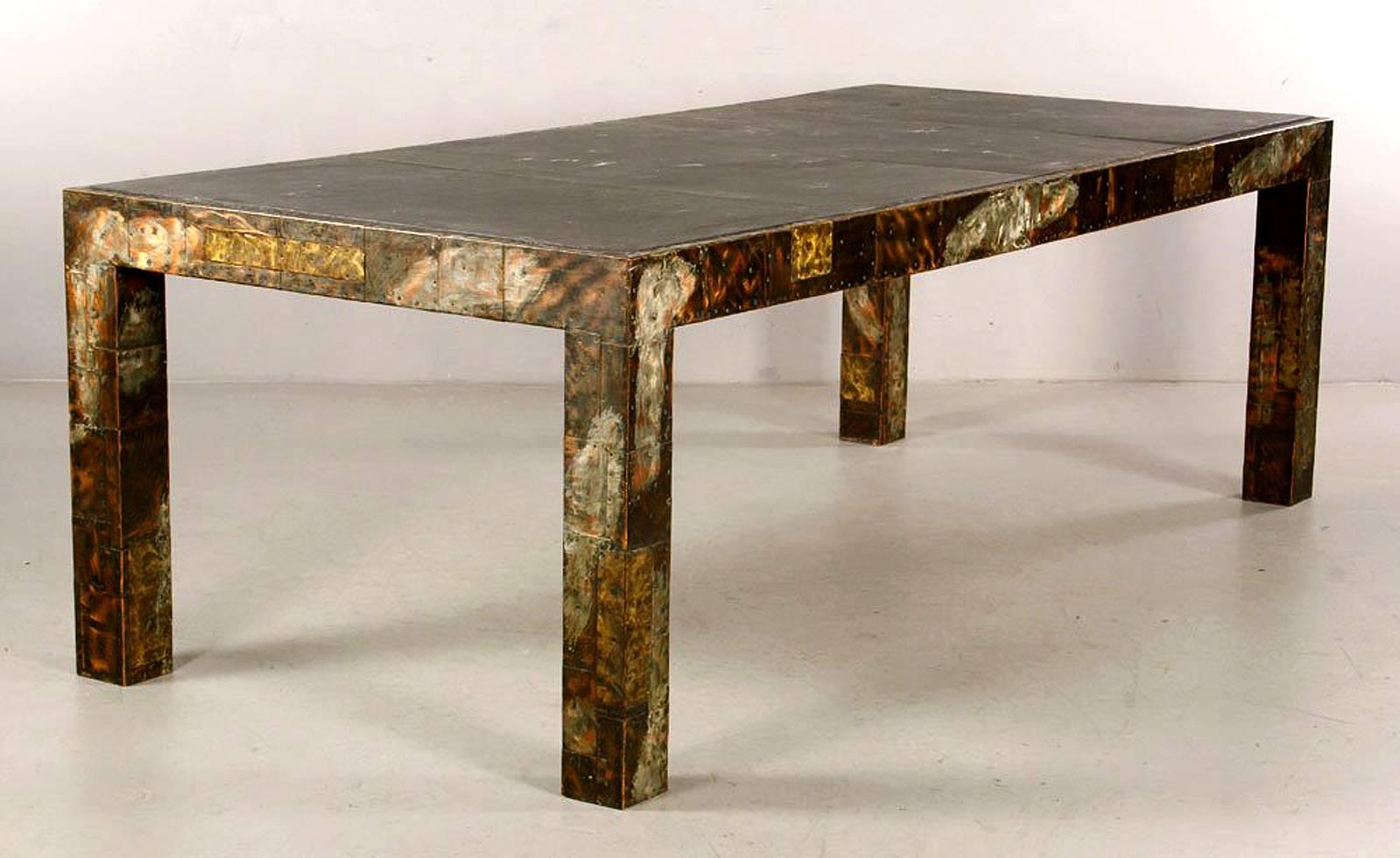 A large-scale one piece dining table in metal patchwork series designed by Paul Evans, circa 1970s. A rare dining table version of Model PE-45, which is normally produced as coffee table. This table features iconic metal patchworks with brass,