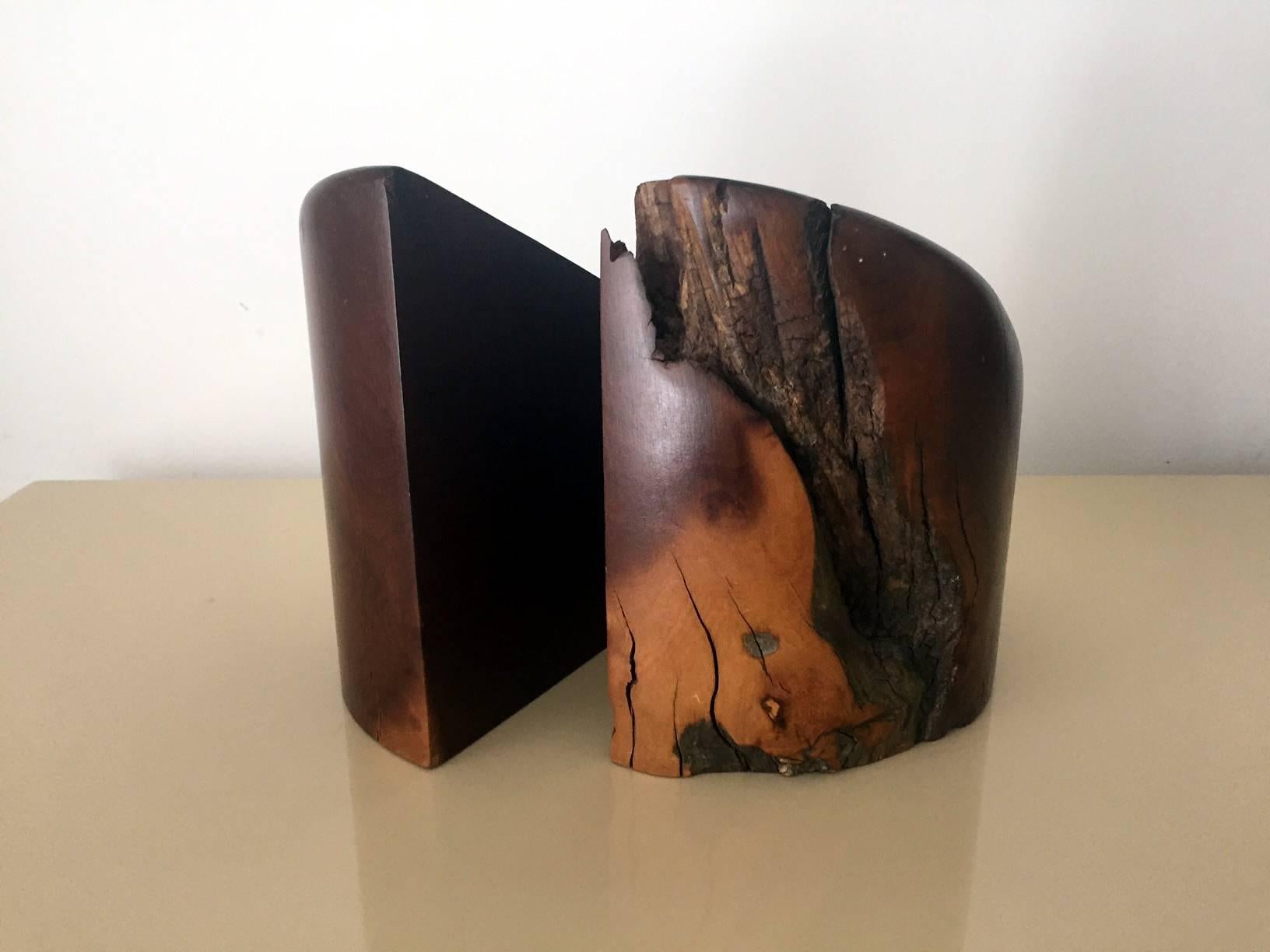A pair of large heavy bookends designed by Don Shoemaker and made by Señal S.A. Mexico. Made from natural cocobolo, the Mexican rosewood. They feature beautiful wood grains, natural cracks, wormholes, all the imperfections that reflect beauty of