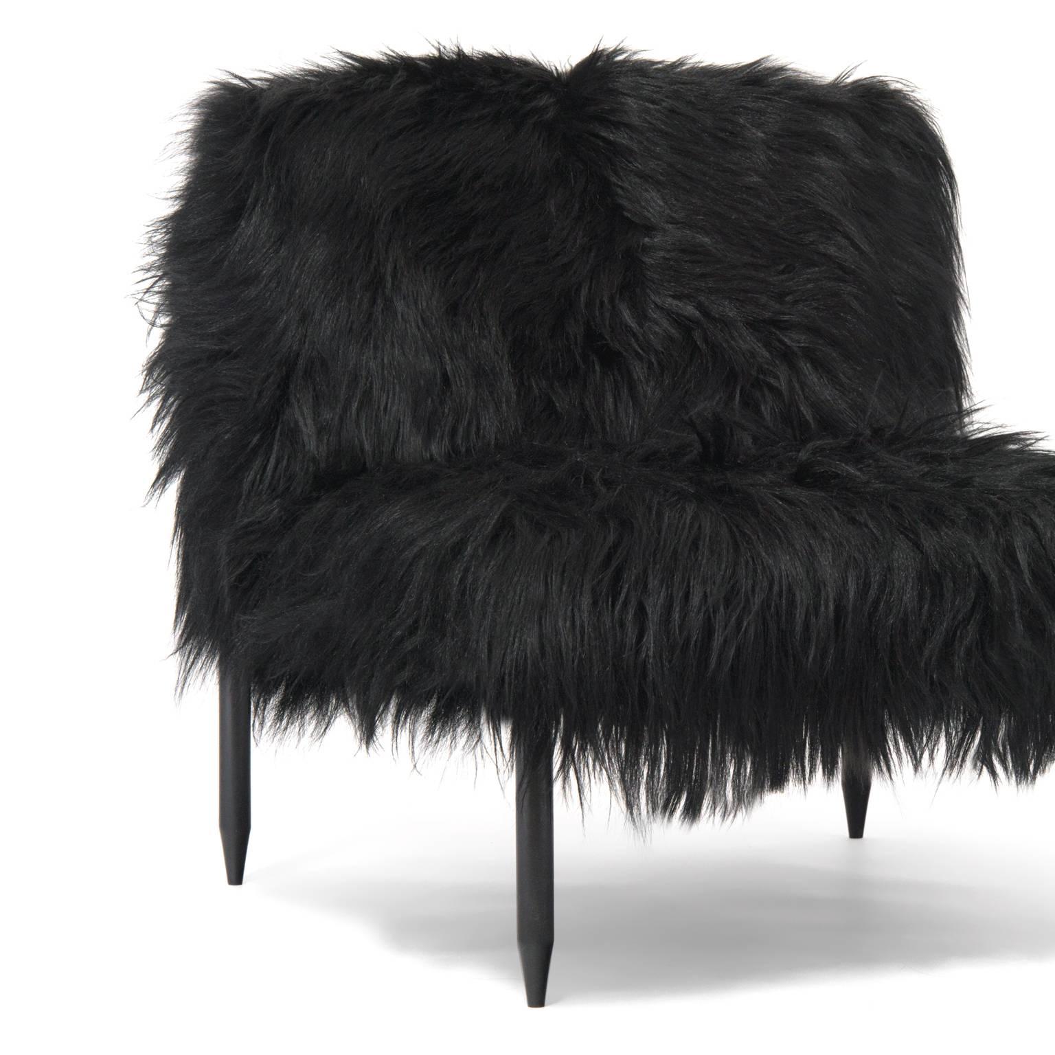 Atelier Demiurge Editions Bianca Slipper Chair shown with goat hair resting on an ebonized frame. Inquire for customization options. COM 5 yards.
 
Atelier Demiurge Editions pieces are made to order. Please contact the gallery for a