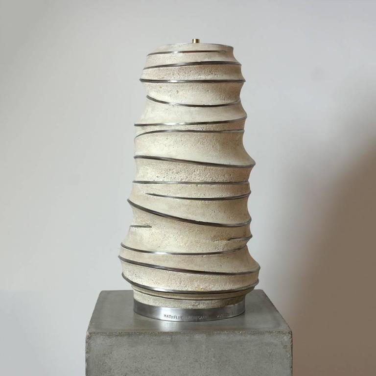 Steel and Concrete Lamp Base.

Signed, Unique Piece
2015.

Mathilde Penicaud was trained in ironworks, and most of her pieces begin as steel and concrete, mutating with other materials and processes as they take shape. The materials themselves –