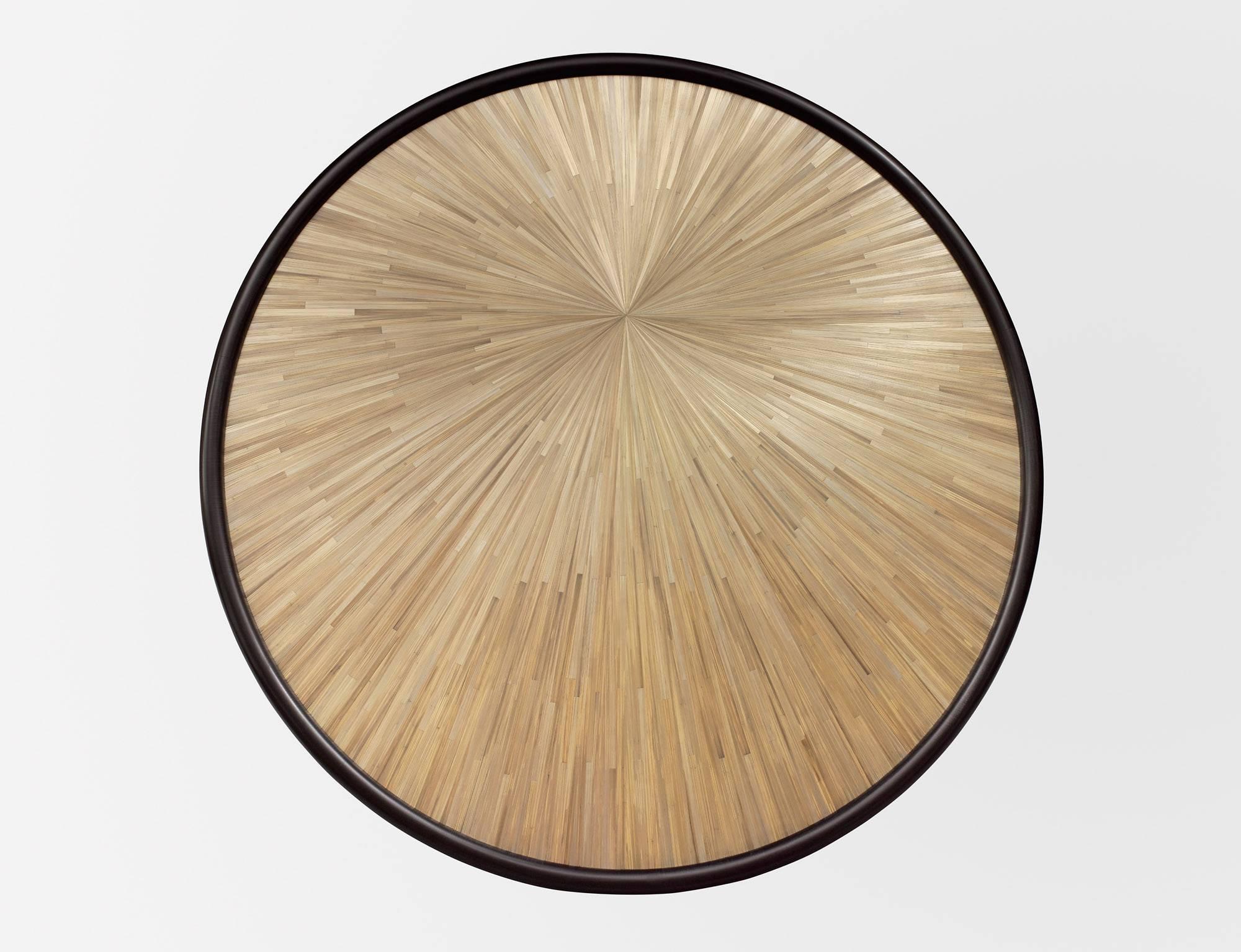 Coffee table, 2008

Edition of eight

Also available in multiple colors and finishes

Top: Straw marquetry, sun pattern, glass top

Measures: H 15.75 x D 55.1 inches

(H 40 x D 140 cm).

Nicolas Aubagnac is a French designer based in Paris since