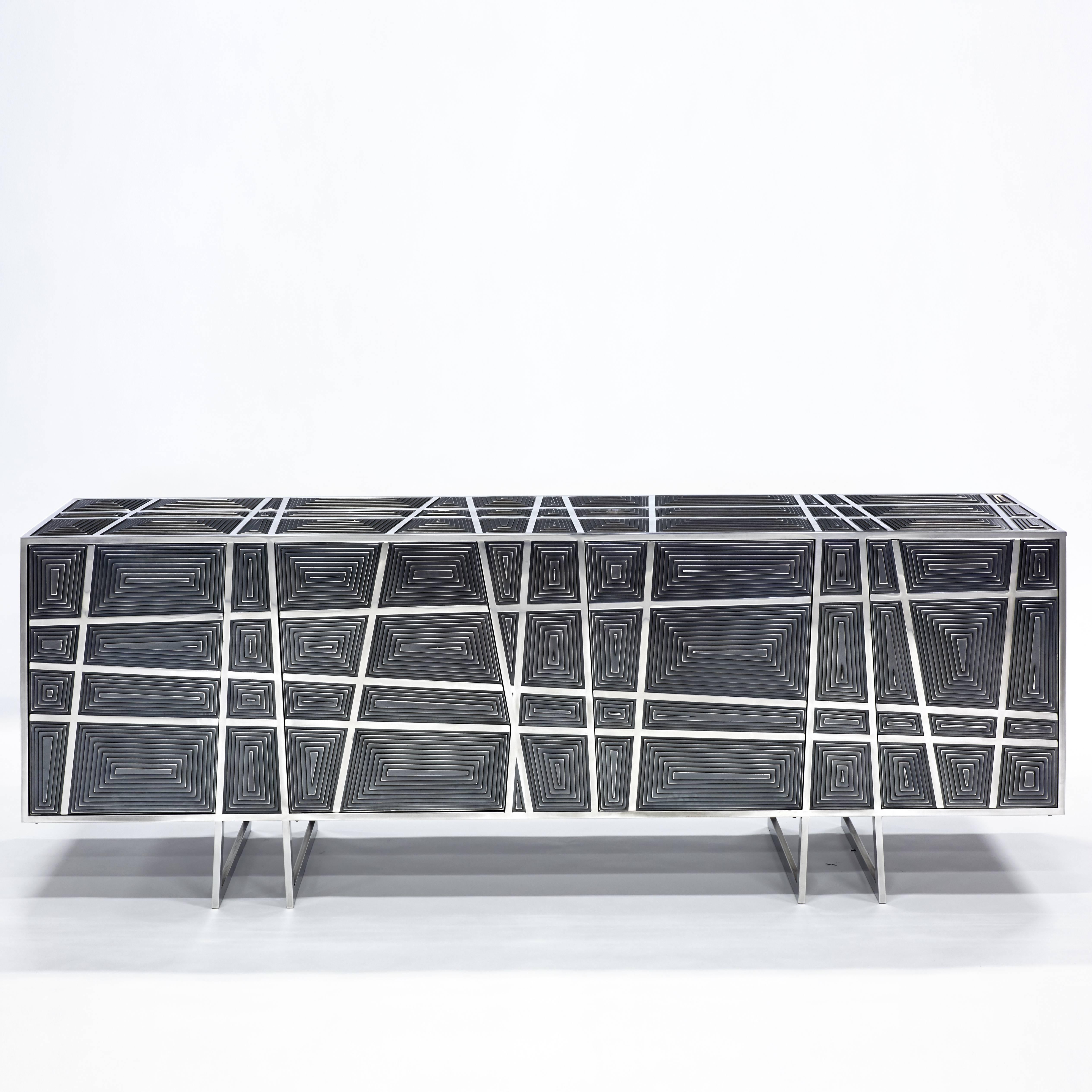 Cabinet, 2017

Edition of 12

Polished stainless steel, black patinated steel

Four doors

measures: H 29.9 x L 83.8 x W 18.1 in

(H 76 x L 213 x W 46 cm).

 