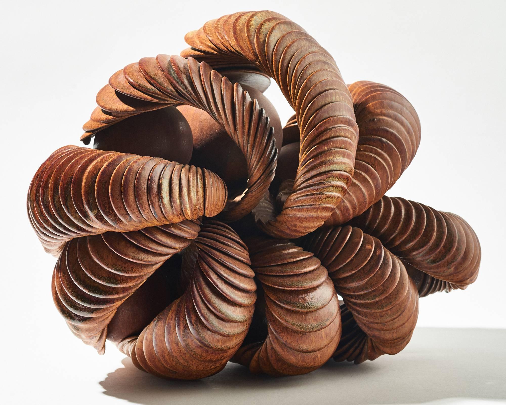 Kuhn produced this sculpture in her own workshop that she opened in 1957 in Düdelsheim. She specialized in the production of decorative ceramics, often using one single basic element that she repeated in a serial fashion. This particular sculpture