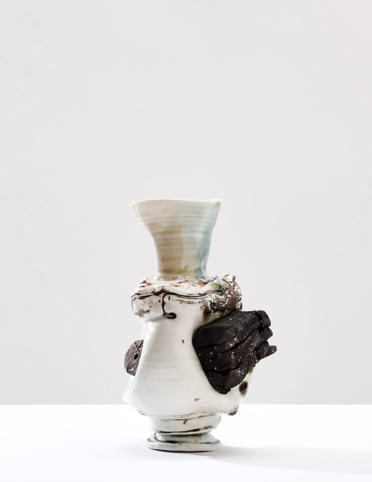 Reinterpreting forms associated with traditional vases and decorative objects, British ceramist Gareth Mason magically turns his ceramic creations into highly textural bodies. He incorporates materials such as porcelain, oxides, and lustre to the