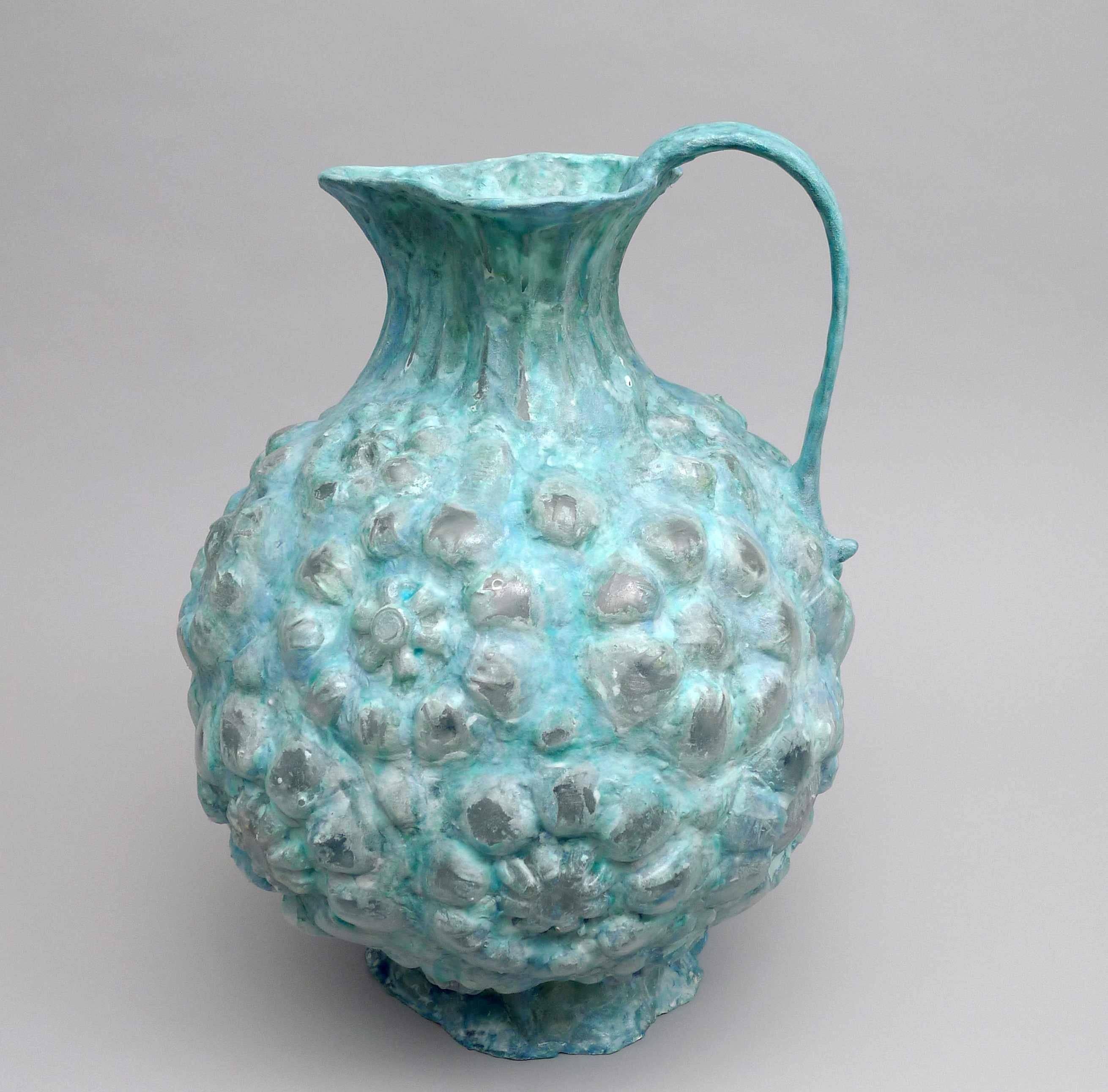 Shari Mendelson makes handmade sculptures that are constructed out of discarded plastic bottles and inspired by ancient vessels. Her interest lies in the balance between emulating the ancient objects that she loves and creating her own original