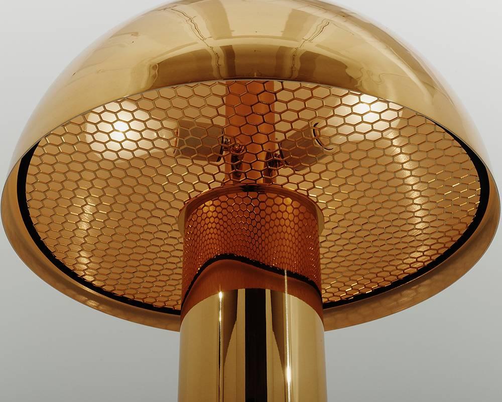 Designed by Karl Springer in the 1980s, this unique table lamp design is offered today anew with dimmable LEDs, reissued by Karl Springer Studio exclusively for Todd Merrill Studio. 

The brass mushroom shaped lamp features a brass cylindric base