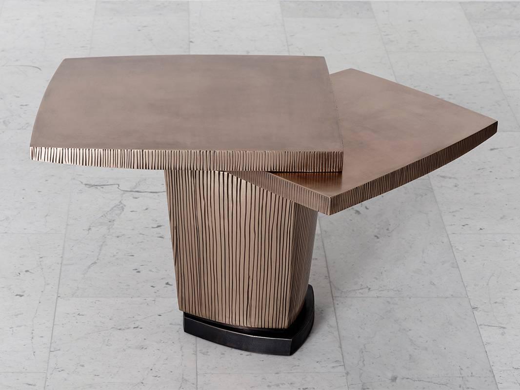 Gary Magakis’ unique textured bronze ledges one side table epitomizes the sculptor’s distinct approach to creating bold and dense geometric forms that simultaneously exude an elegant, buoyant aesthetic of Modernism. At once a functional object piece