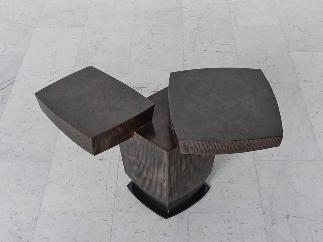 Gary Magakis’ handmade, unique patined steel Ledges two side table epitomizes the sculptor’s distinct approach to creating bold and dense geometric forms that simultaneously exude an elegant, buoyant aesthetic of Modernism. At once a functional