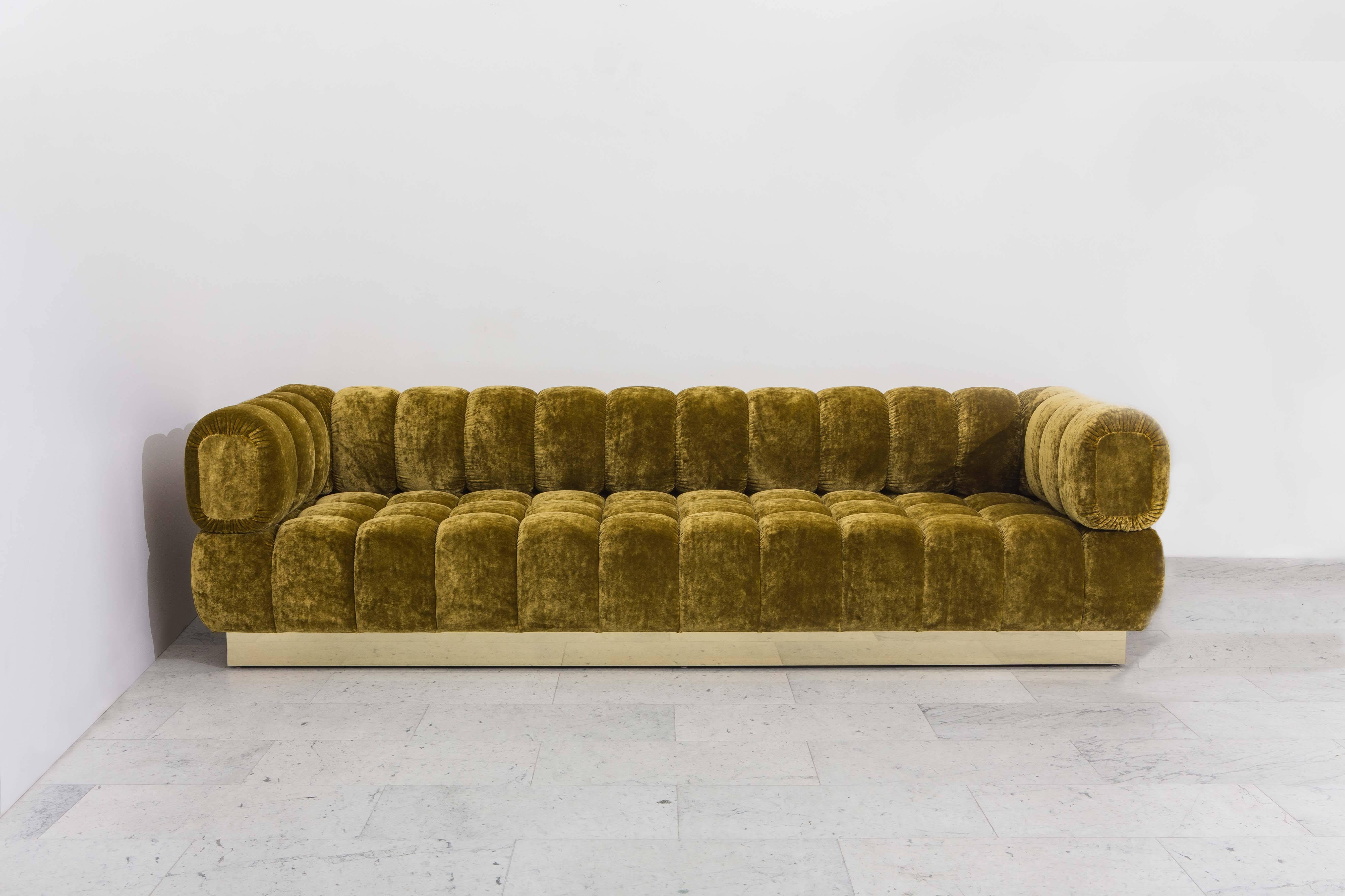 This custom original tufted sofa is the single-base option for Todd Merrill’s unique, and customizable seating design. Ideally proportioned, The standard features back tufts that are the same height as the seat tufts. Other back heights are