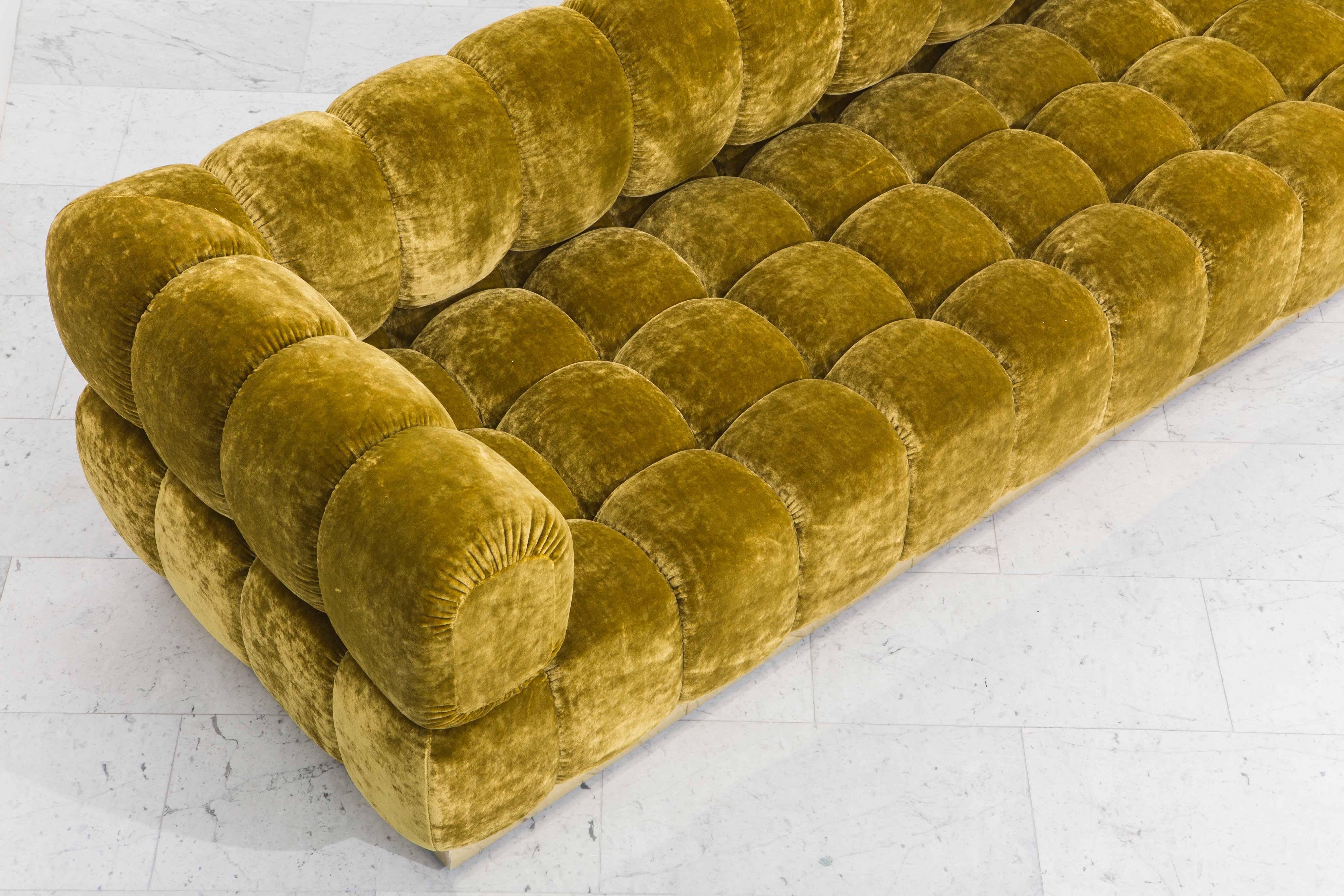 gold tufted sofa