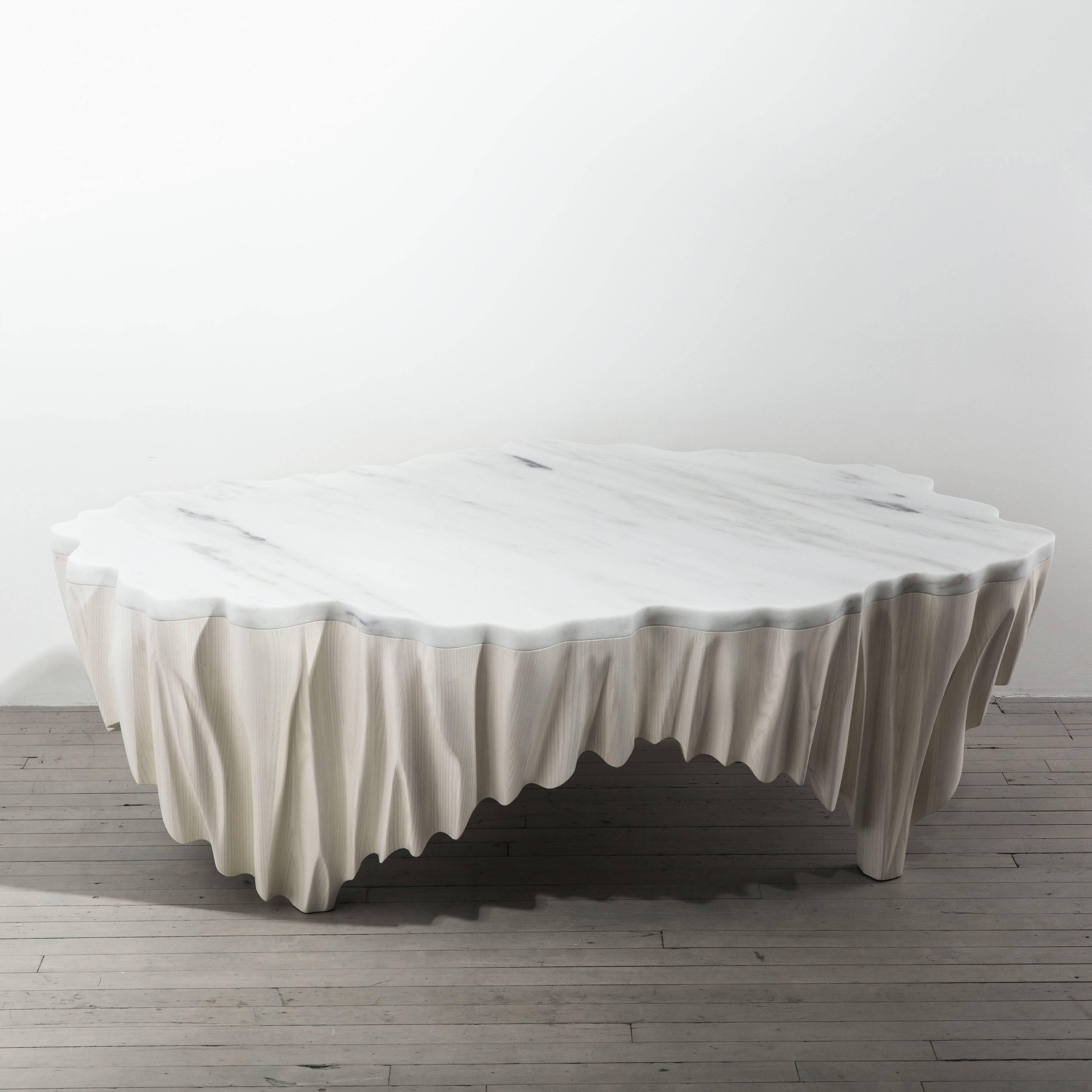 Markus Haase’s table, Aeolian, is inspired by ripples in windblown sand, epitomizing the sculptor’s distinct approach to fluidly melding stone and wood together. The artist’s two decades of experience as a sculptor are evident in his masterful