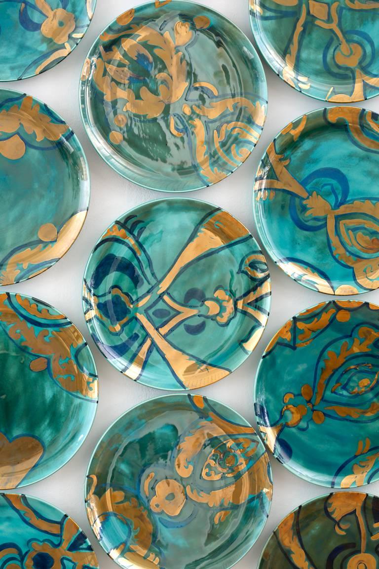 Using the ceramic surface as both her canvas and subject matter, Molly Hatch extends her historically-inspired contemporary repertoire with Aria, a hand-painted wall installation.

Comprised of 37 earthenware hand-painted plates, the glazed