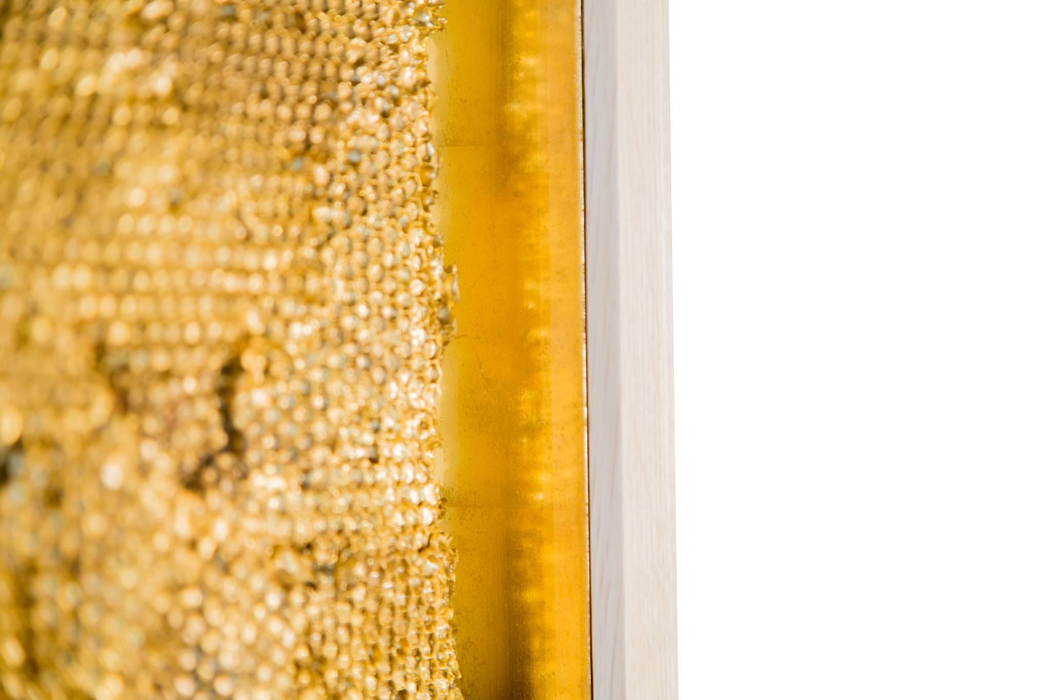 Tapestry Triptych, 2017, a large-scale wall hanging is constructed of three panels of deeply faceted overhanging layers of plaster honeycomb, gilded and highly patinated. The substantial overlapping layers of the work gently hang giving the work the