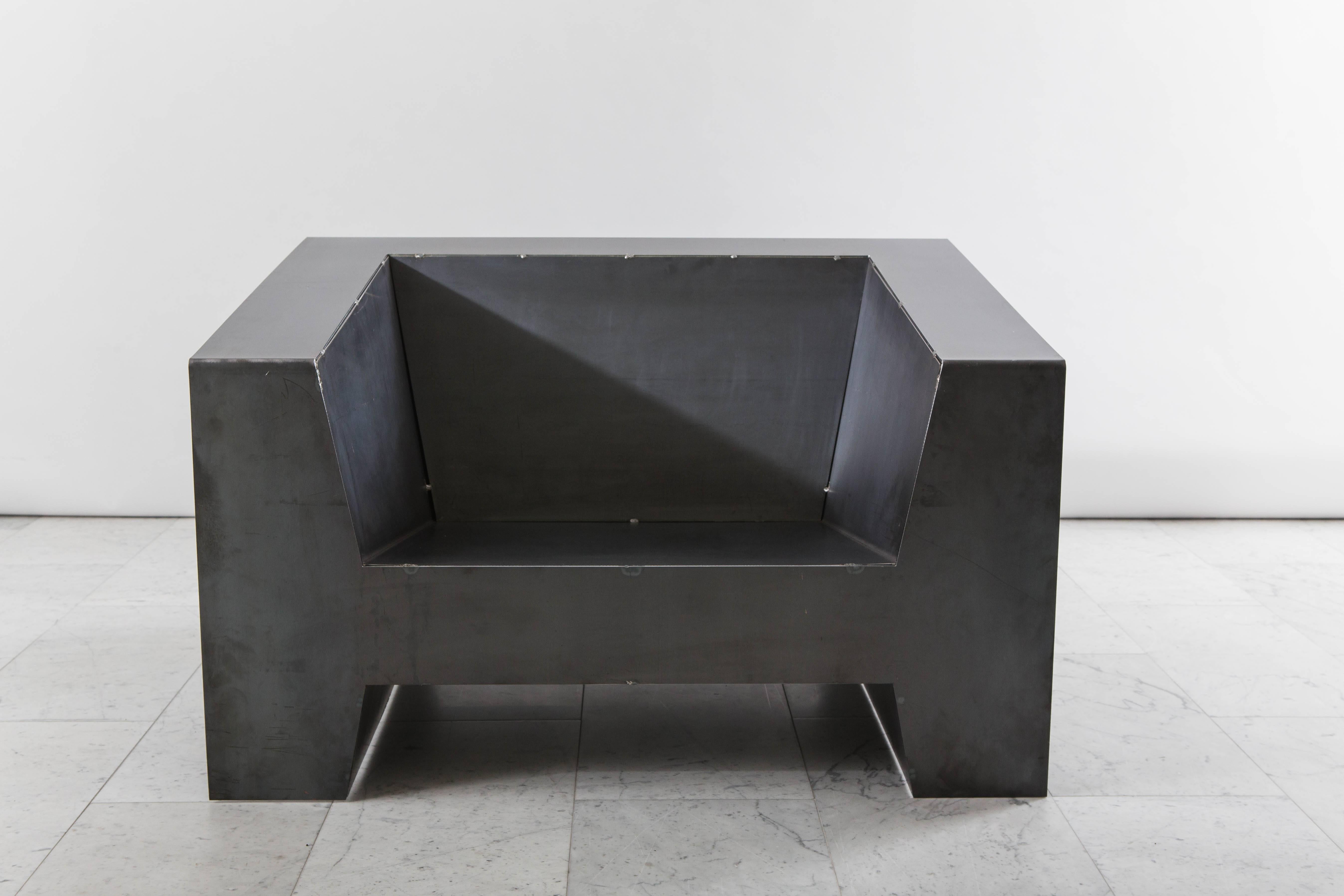 Todd Merrill studio represents the unique seating by Chris Rucker, innovatively made from recycled construction materials. Challenging everyday transient objects, the low club chair is made of construction mild steel with black wax. As it is
