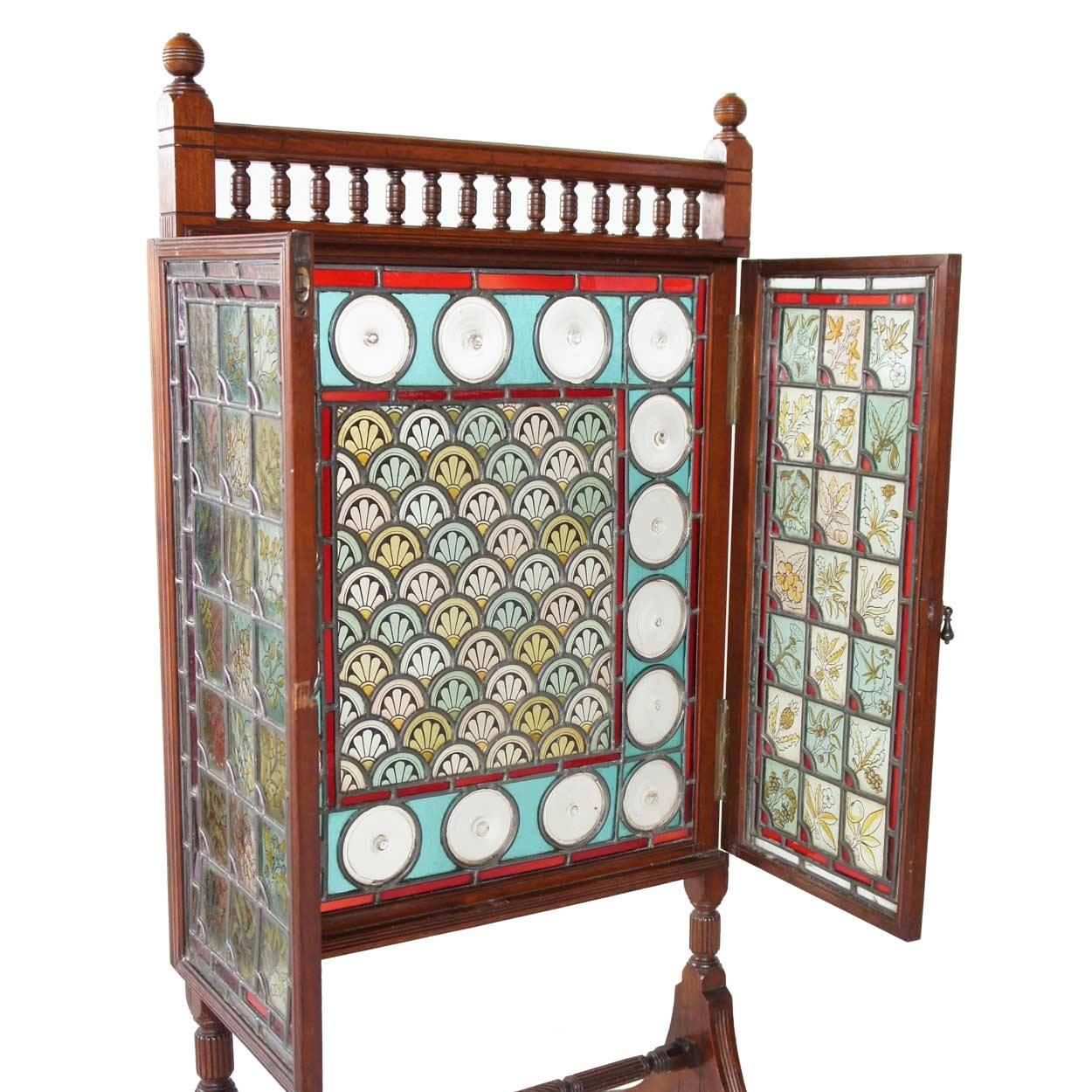 Attributed to Cox & Sons (England, 1837-81)
In the style of William Morris, this antique leaded and painted glass fire screen was made by Cox & Sons, who were ecclesiastical stained glass designers and furniture makers. Notice the hand painted