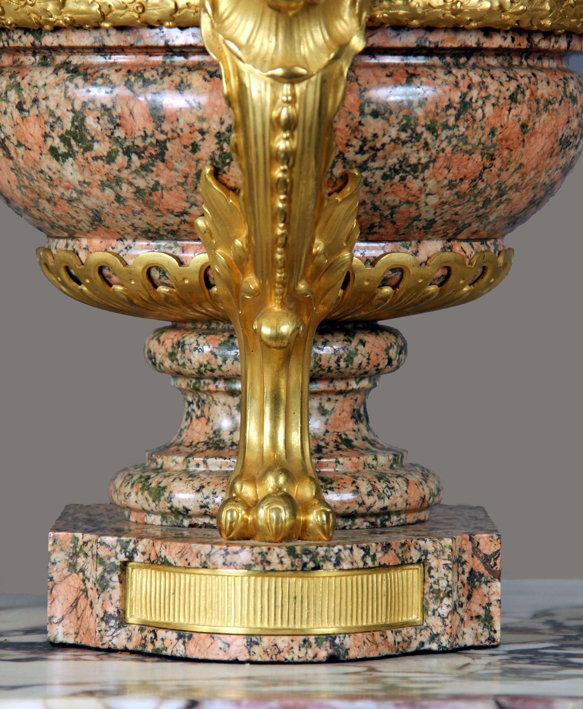 Gilt Pair of Late 19th-Early 20th Century French Bronze-Mounted Pink Granite Urns For Sale