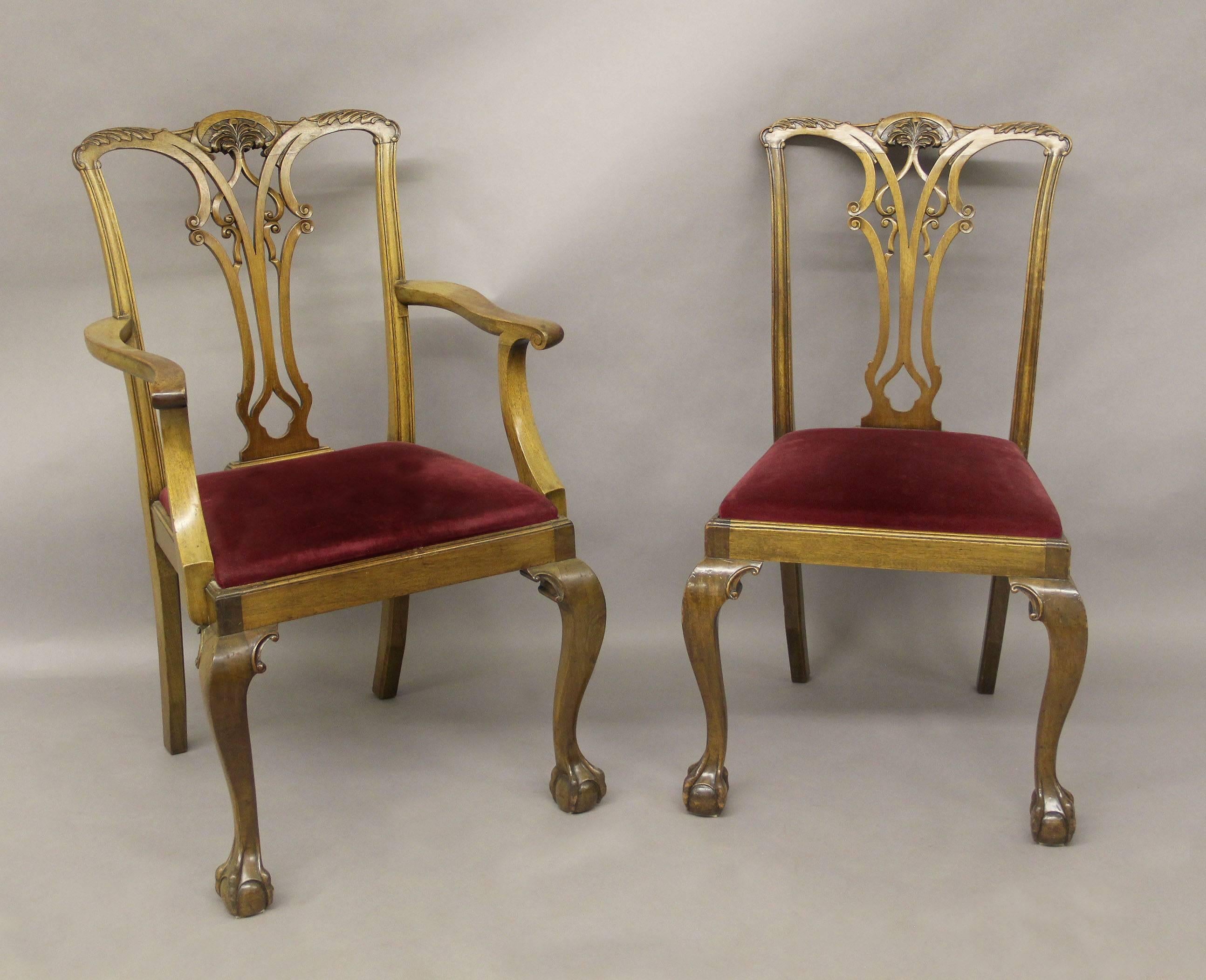 A set of eight late 19th-early 20th century Chippendale style dining chairs.

Comprising of two arm and six side chairs, ball and claw feet.

Armchairs:
Height: 39 inches/99 cm.
Width: 23.5 inches/60 cm.
Depth: 19 inches/48 cm.

Side