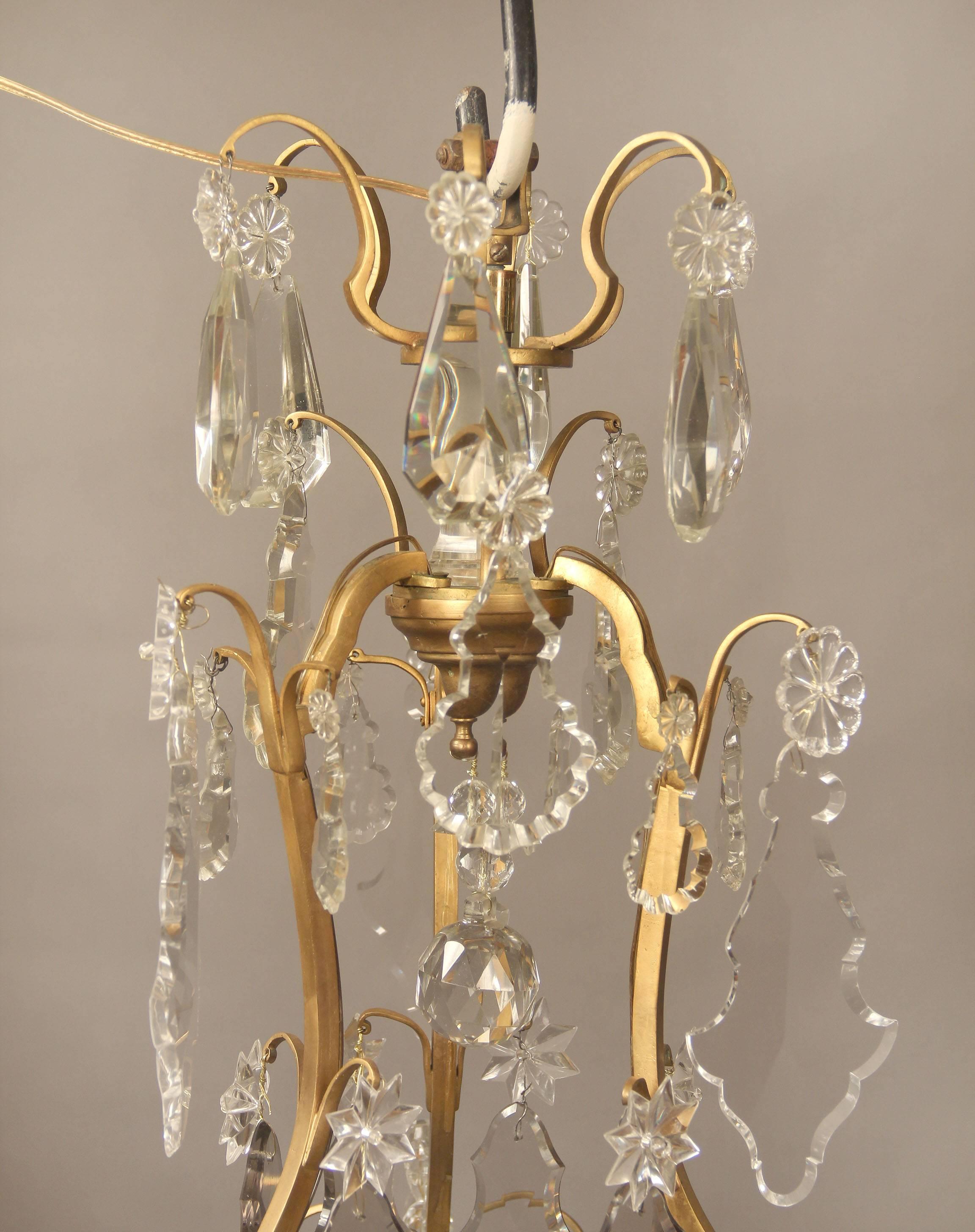 French Nice Early 20th Century Gilt Bronze and Crystal Nine-Light Chandelier For Sale