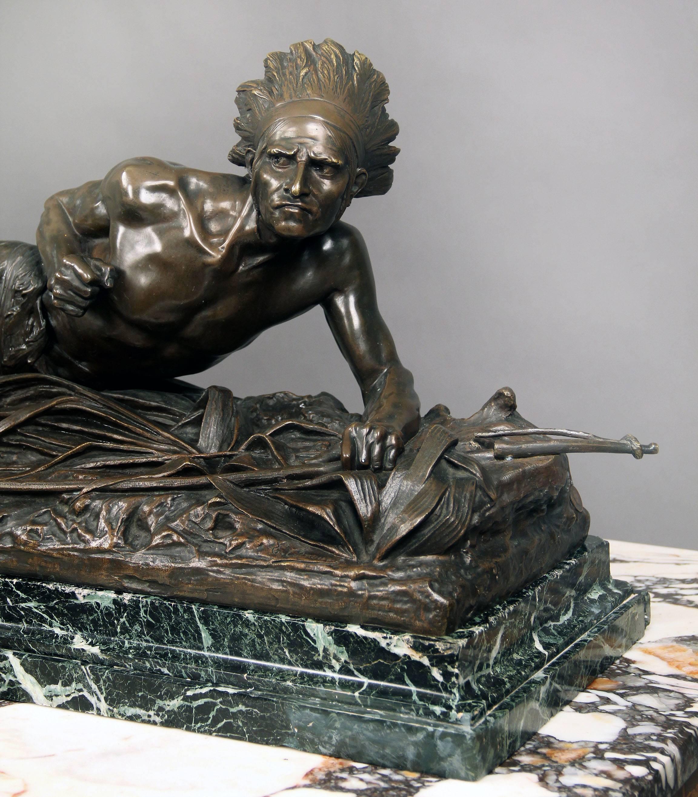 A very fine quality late 19th century bronze sculpture of an American Indian

By Edouard Drouot

The Native American is crawling on the grass, sneaking up on his prey as he hunts with his bow and arrow. Sitting on a green marble base.

Edouard