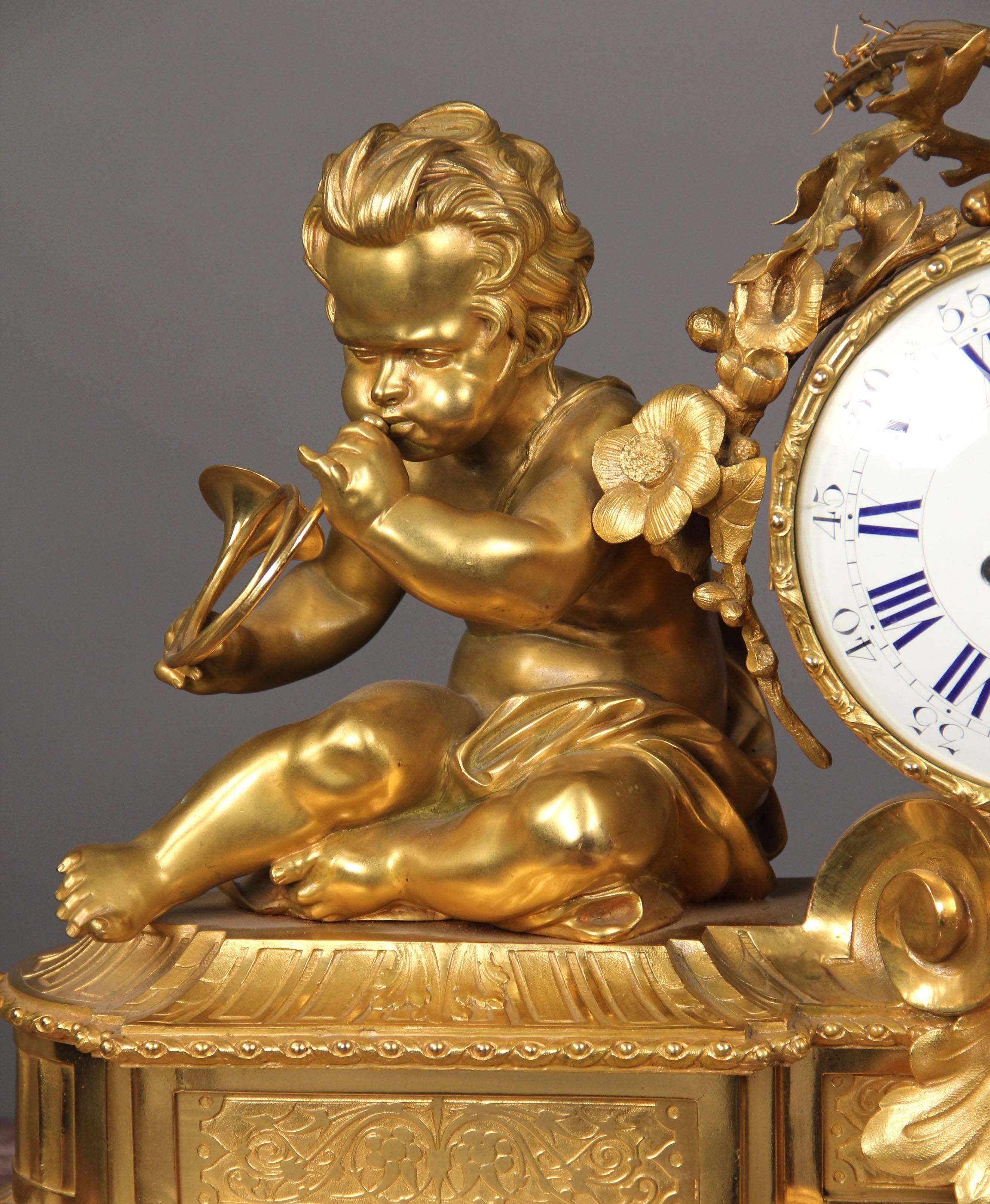 A very fine late 19th century gilt bronze mantel clock 

The clock face is flanked by one child playing the French Horn, the other playing with finger cymbals, all raised on an elaborate bronze base.