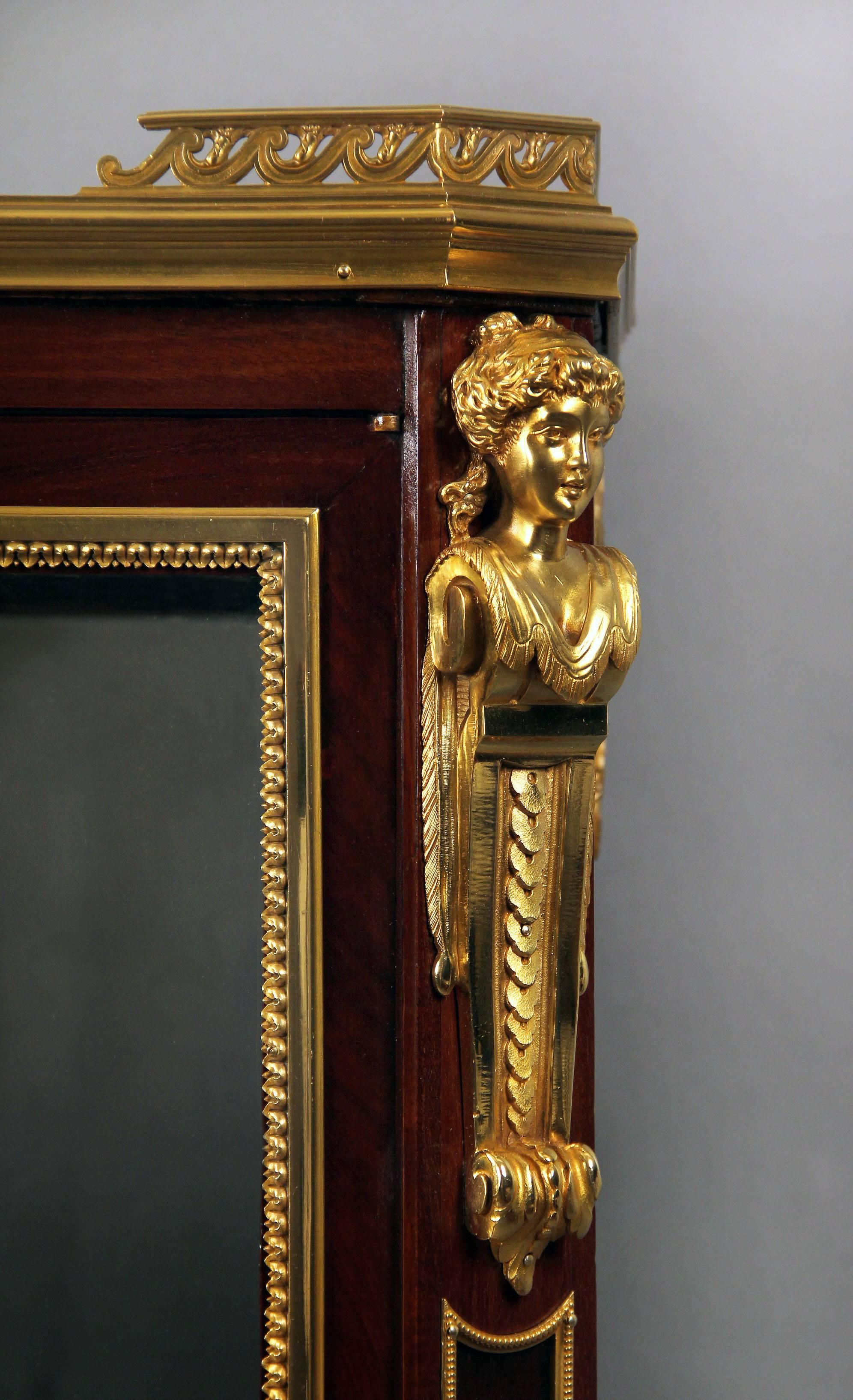 A fine late 19th century Louis XVI style gilt bronze-mounted double vitrine cabinet

By Henri Picard

The vitrine fitted with a nice inset marble top, the upper cabinet with a long single drawer and bronze women busts on the corners. The bottom